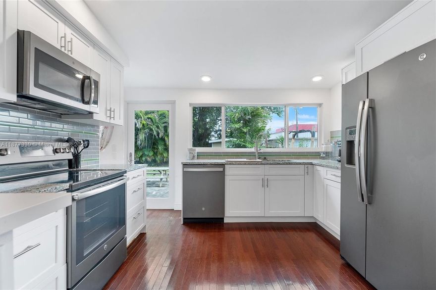 Charming and move-in ready, this beautifully maintained 1,116sqft home offers a perfect blend of style and function. It features impact windows and doors, a 2022 roof, and a paver driveway for lasting curb appeal. Inside, enjoy real hardwood and tile floors with no popcorn ceilings. The kitchen boasts quartz countertops and a sleek GE appliance package. Bedrooms include ceiling fans, and there's a large front-load washer and dryer for added convenience. The spacious yard includes a shed for extra storage. Located near shopping and major highways, this home combines comfort, location, and value. Schedule your showing today!