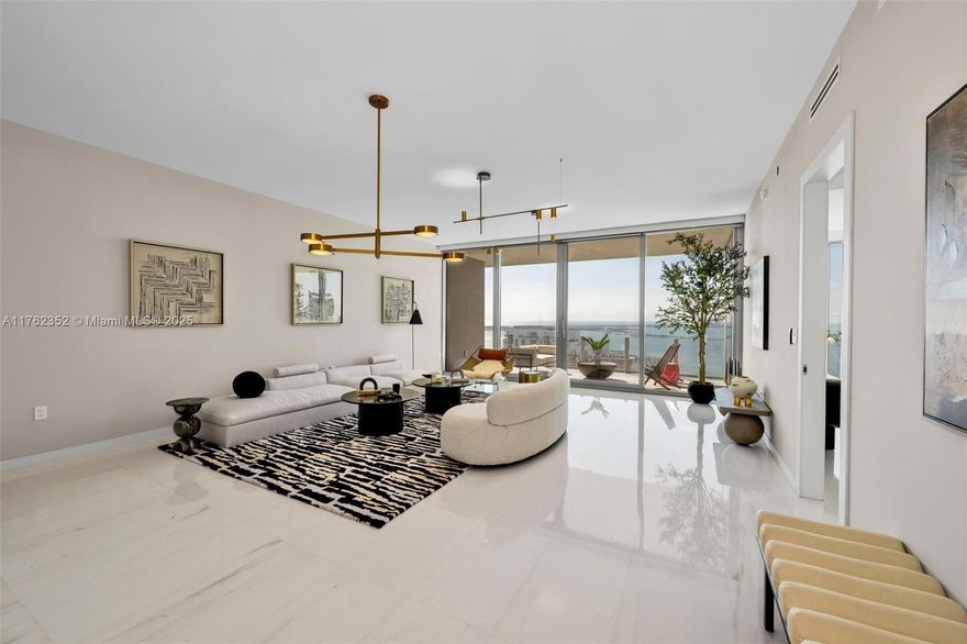 Brand new luxury unit at just completed Aston Martin Residences. Breathtaking views and tons of light will welcome you to this luxury 3,078 sqft unit: 3 beds/4 1/2 baths, den, family and staff. Every room has on suite bathroom, walking closet & motorized blinds. Top-of-the-line Gaggenau appliances, thassos marble flooring, private foyer, electric socket in parking spaces. Unit has been completely upgraded. Sky Amenities level featuring 42,500 square feet of luxury amenities, including an infinity pool, spa, private movie theater, putting green, state-of-the-art gym and many more. This is luxury living at its best!