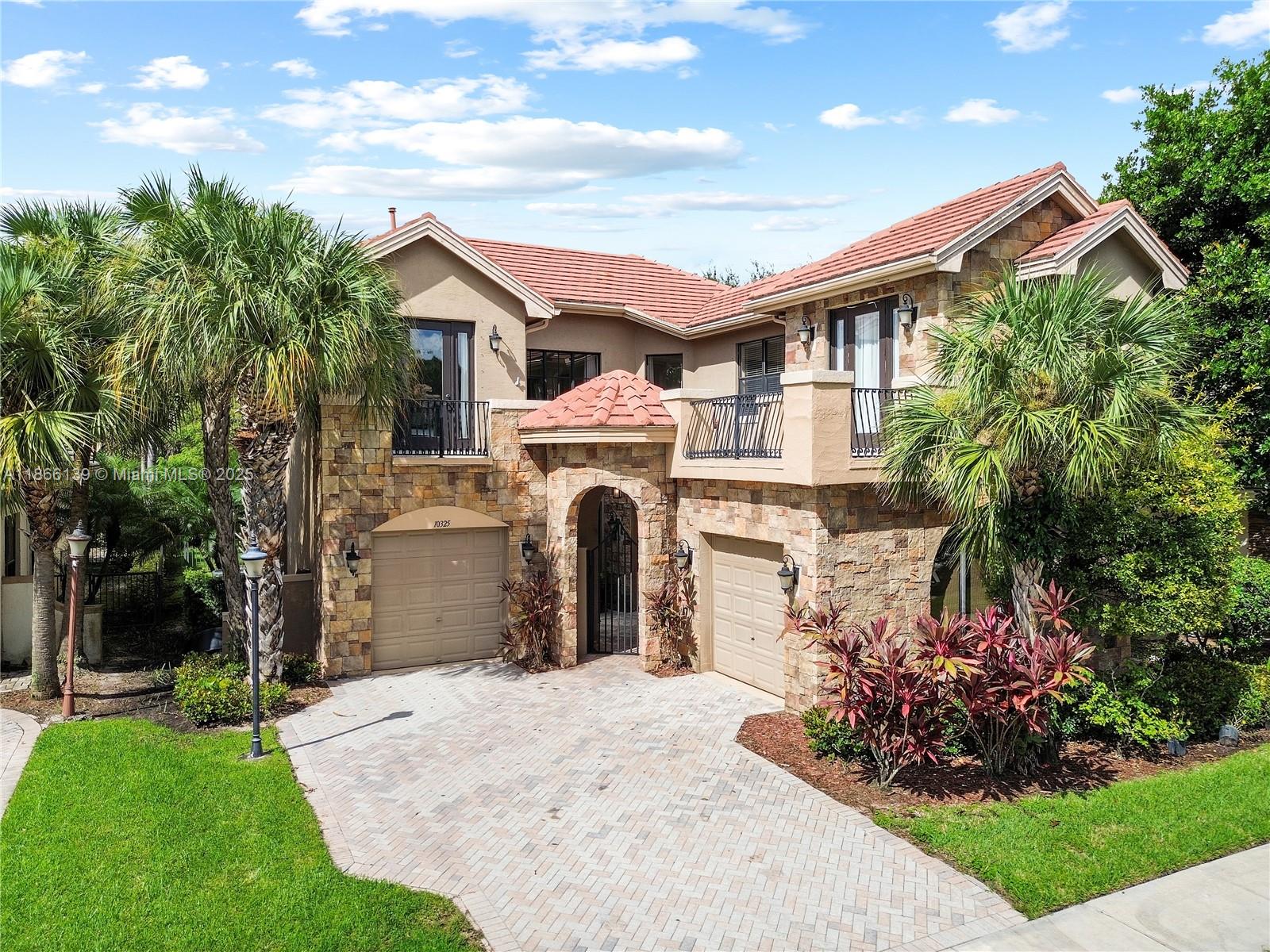 Welcome Home & Experience the Resort-style community of Versailles in Wellington! This Moulin Rouge model 4 Bed/4.5 Bath boasts dramatic 24-ft ceilings, graceful wrought-iron stairways, and bright open interior. The gourmet kitchen showcases French cabinetry, granite countertops, and stainless appliances, while the expansive living and dining rooms are ideal for entertaining. Escape to the spa-like primary suite with dual sinks, Roman tub, shower, and walk-in closet, as all secondary bedrooms offer ensuites. With a 2-car garage & custom upgrades. Community amenities including a clubhouse, infinity pool, spa, fitness center, tennis, and playgrounds, with 24/7 manned gated security. Close to all Amenities, Elite schools ,Equestrian town & Shopping malls.