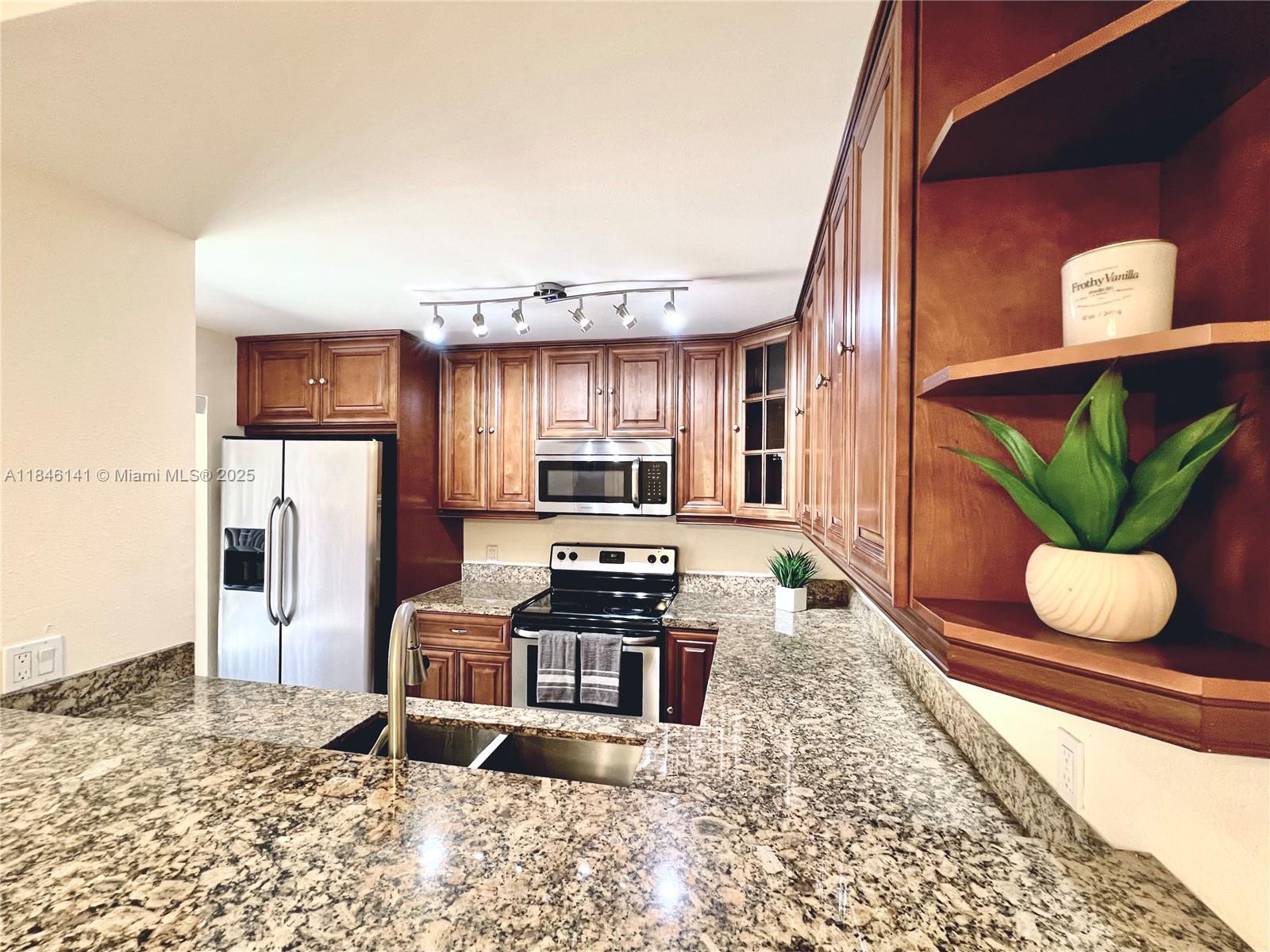 Available for Annual Rent – This beautifully updated 2-bed, 2.5-bath townhouse offers a spacious open-concept layout with modern finishes throughout. Enjoy a stylish wood kitchen with updated cabinetry, sleek bathrooms, and a convenient in-unit washer and dryer on the first floor. The private fenced courtyard is perfect for relaxing or grilling outdoors. Other features include new A/C (2023), plenty of storage, and two assigned parking spaces. Community amenities include a pool, tennis courts, basketball court, and playground. HOA covers roof & exterior maintenance, water, sewer, and building insurance. Ideally located near dining, shopping, downtown West Palm Beach, and I-95. Easy to show—schedule your tour today!