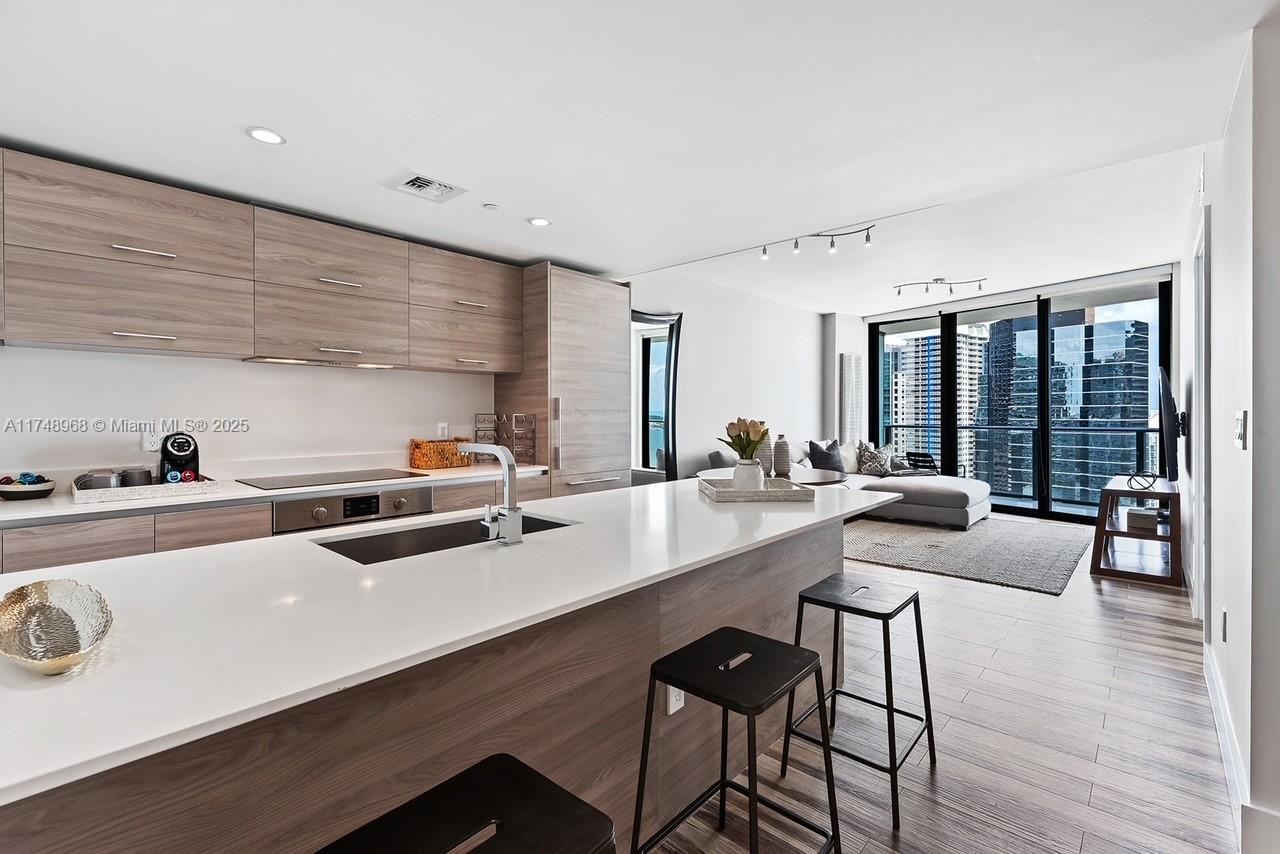 Spectacular Furnished 1+Den Residence. The unit offers an expansive balcony and amazing views of Biscayne Bay and Miami Skyline. The kitchen features Italian cabinetry, Subzero and Bosch appliances, Quartz countertop. 5-Star Amenities include: Rooftop Pool, full-service Spa & Fitness Center, 2 Infinity pools, Garden Club w/ private Cabanas, Movie Theater, Game Room, Two restaurants - Filia by Chef Michael Schwartz. Centrally located in the prestigious Brickell area, SLS Residences is within a block of the shops, cafes, and entertainment at Brickell City Centre: Saks 5th Ave, Zara, La Centrale, Casa Tua, CMZ Theater, etc & Mary Brickell Village. 15min from Wynwood, Design District, South Beach and the Miami International Airport. Also Available for Short Term Rental