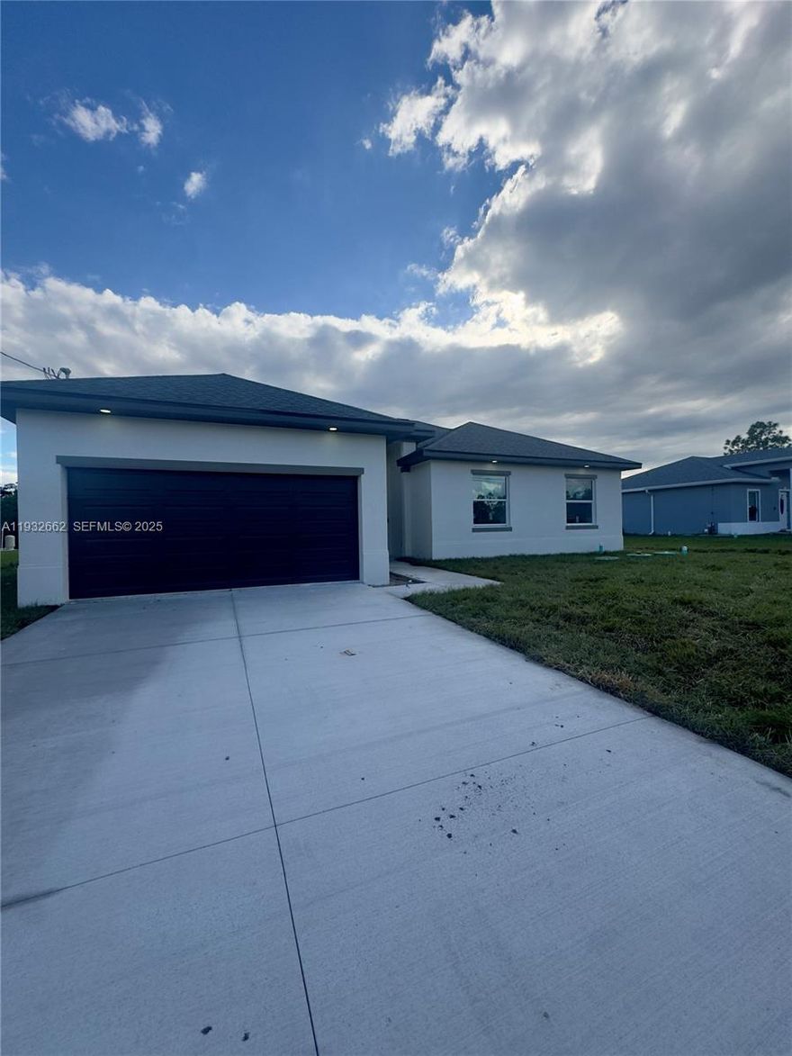 Stunning brand-new 2025 construction 3BR + den / 2BA Salina model offering 2,135 sq ft of modern living on an 80x125 lot. Step inside to glossy white 24x48 rectified marble-look tile flooring, 10’ ceilings, and a bright open great-room layout. Custom kitchen features soft-close cabinetry, high-end wall panels, quartz countertops and a large island that anchors the main living space. Flexible den works perfectly as a home office, media room or guest space. Quality construction throughout: impact-rated windows and doors, fiberglass roof, and 160 mph wind rating for peace of mind. Home is on well & septic for lower monthly expenses. 1-car garage with oversized driveway provides excellent parking, and the covered lanai extends the living area outdoors with room to relax or entertain. Situated in a quiet residential setting with easy access to local amenities and main commuter routes. Environmental report on file confirming upland site with no wetlands or listed species. Just completed, never lived in, and easy to show—ready for its first owner.