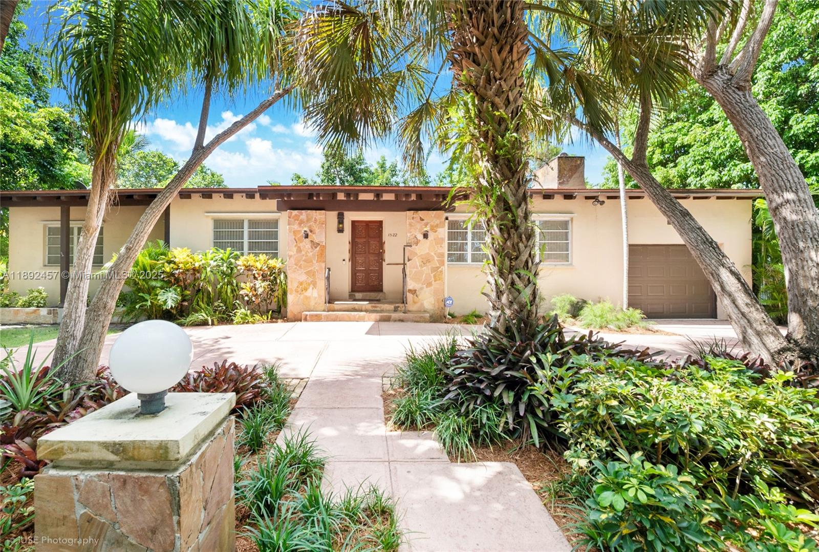 Discover the potential of this classic mid-century residence nestled in the most desirable neighborhood of Coral Gables just minutes from the University of Miami. This spacious home features timeless architectural details and generous living areas, offering the perfect canvas for renovation or modernization. Now……envision a large covered patio ideal for outdoor entertaining, with a BBQ area overlooking the inviting pool.
The lush backyard is enhanced by mature fruit trees, creating a private tropical oasis. With its expansive lot, serene setting, and proximity to top-rated schools, parks, and the vibrant shops and restaurants of Coral Gables, this property presents a rare opportunity to create your dream home in a highly sought-after location.