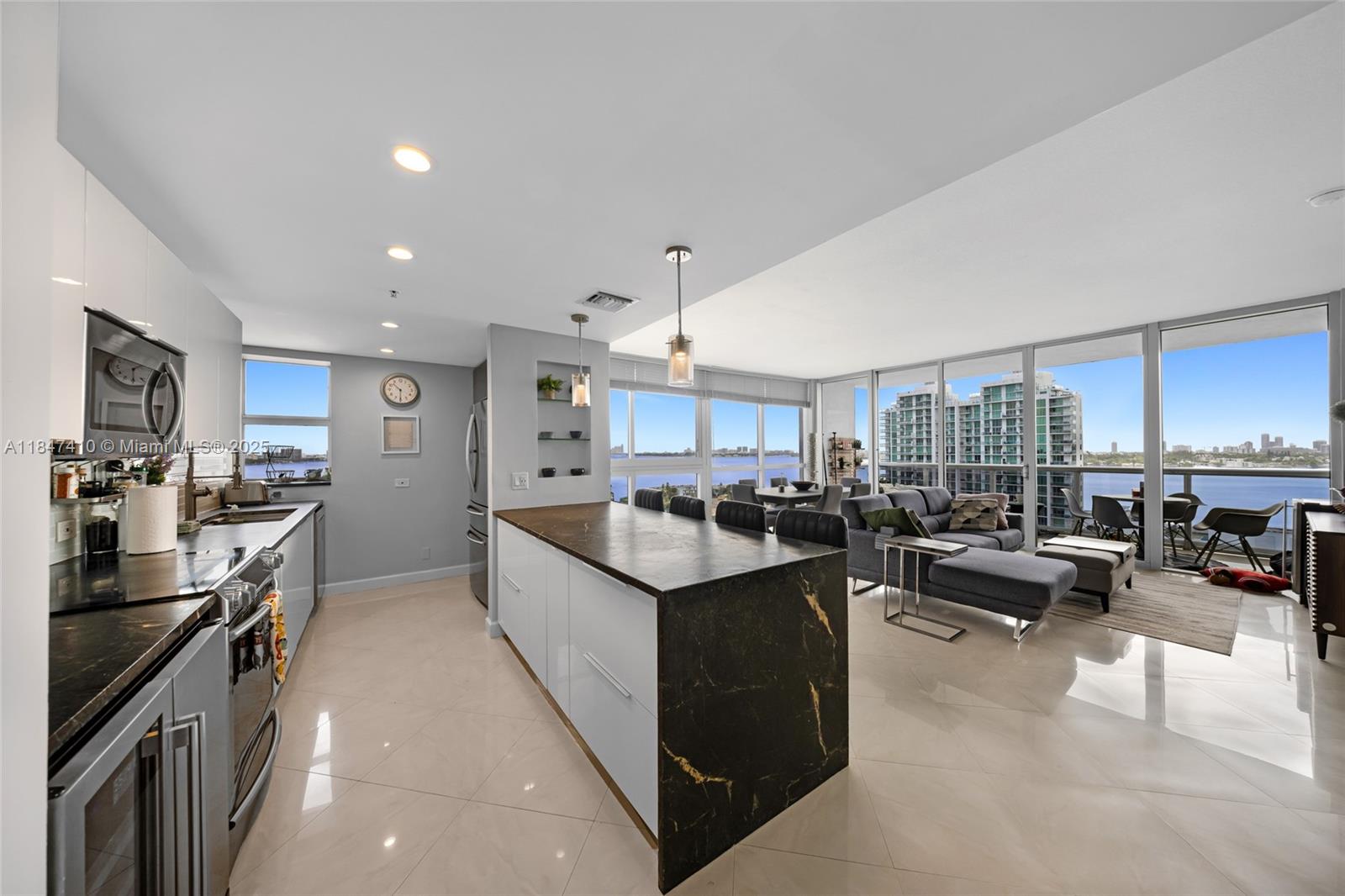 Incredible value in Blue Bay Tower! This high-floor 3-bed, 2.5-bath corner unit showcases panoramic bay and city views through walls of glass allowing for a glimpse of both sunrise and sunset. The open and airy layout offers a remodeled kitchen with waterfall peninsula, wine fridge, and sleek cabinetry along with pantry storage. All bedrooms are generously sized with stunning water views from each, including a spacious primary suite with walk-in closet and a spa-style bathroom. This boutique building features gym, sauna, pool all on the rooftop of the building for 360 degree views of the ocean and city as well as a private marina with potential available slips for rent/sale.
