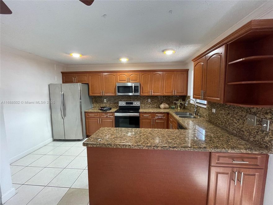 This beautifully updated townhome offers  2 oversized bedrooms and 2.5 baths, this home is perfect for comfortable living and entertaining. Key features include: Upgraded kitchen with SS appliances, Modernized bathrooms with sleek finishes Freshly painted interior, Brand new lighting fixtures and hardware, Ample storage and closet space. Washer & Dryer. Enjoy the private courtyard, an ideal space for gardening, grilling, or simply relaxing with your morning coffee.  The secluded outdoor area offers a peaceful retreat for children to play or for hosting gatherings with friends and family. Both bedrooms are located upstairs, with 2 full bathrooms for convenience and privacy. This charming townhome offers both comfort and style in a desirable North Lauderdale location.