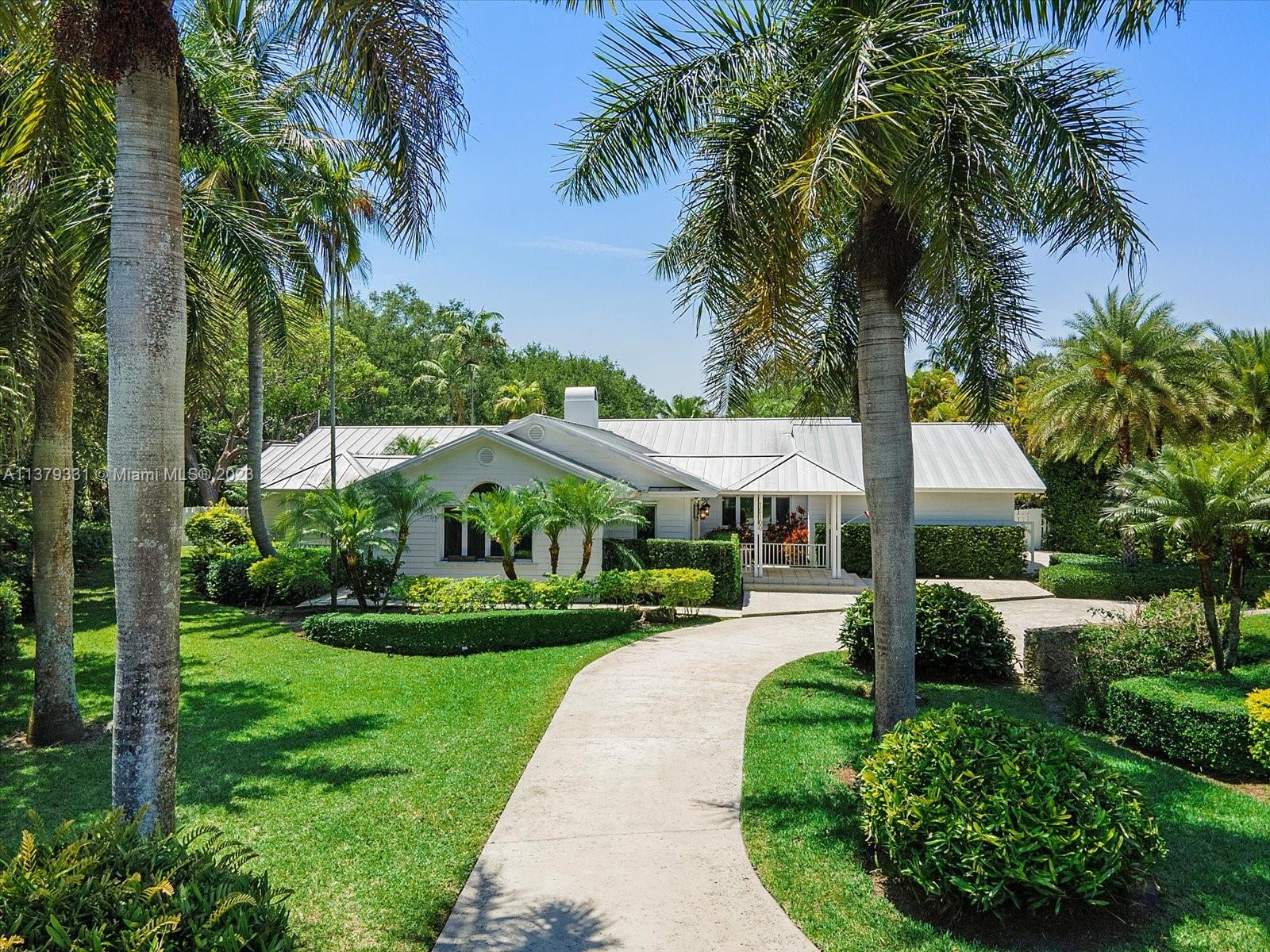 Charming and meticulous one-of-a-kind Key West style, on a gorgeous oak filled acre, near Old Cutler Rd. This 4 bedroom and 4.5 bathroom was rebuilt by a well known architect who enlarged this 50's home. As you enter the spacious, open living area you'll be drawn to the gorgeous Australian Cypress floors throughout. The kitchen has a Viking restaurant style gas oven, 2 Bosch dishwashers, cherry wood cabinets, granite countertops, and huge pantry. The family room features a fireplace and multiple built-ins. The home has a split bedroom plan with a spa-like primary ensuite including a double sized closet, and large walk-in marble shower. Additional storage in the side load 2-car garage and don't forget the gorgeous pool oasis out back outback!