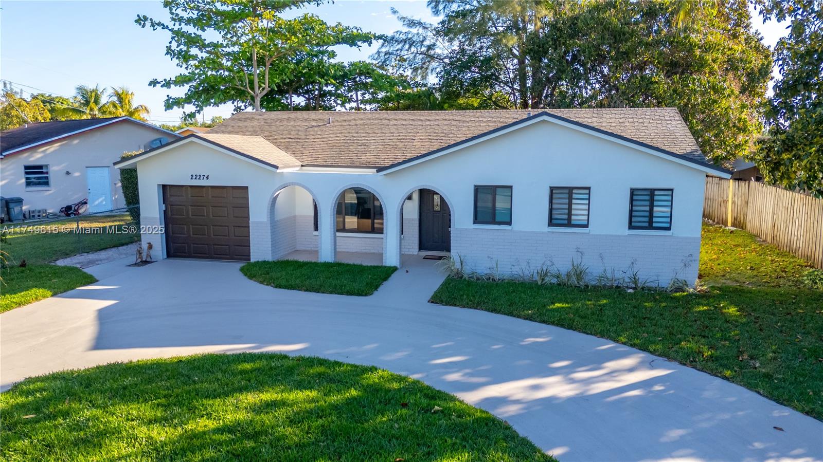 Stunning 3 bed 2 bath fully renovated home in Boca Raton, no expenses spared. Tastefully done with attention to detail. Situated in a quiet neighborhood, close to all amenities. No HOA!!! Excellent location and spacious backyard with new grass and room for a pool, no rear neighbors. It boasts an open concept layout with a gorgeous new kitchen with wood cabinets, quartz counter tops and S/S appliances. New impact windows and doors and new impact garage door with smart opener, smooth ceiling with recessed lighting, Italian porcelain tiles throughout the house. Gorgeous, automated windows treatment, indoor laundry room with full size washer and dryer. All worked done just move in and enjoy!!!