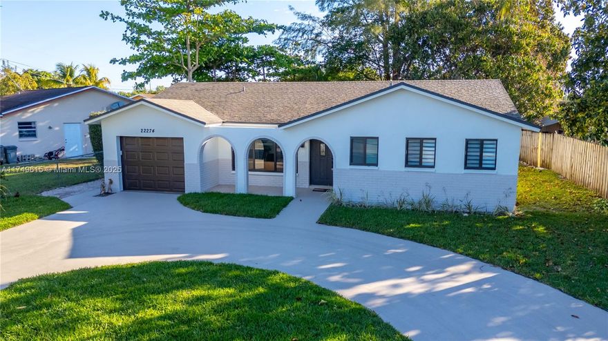 Stunning 3 bed 2 bath fully renovated home in Boca Raton, no expenses spared. Tastefully done with attention to detail. Situated in a quiet neighborhood, close to all amenities. No HOA!!! Excellent location and spacious backyard with new grass and room for a pool, no rear neighbors. It boasts an open concept layout with a gorgeous new kitchen with wood cabinets, quartz counter tops and S/S appliances. New impact windows and doors and new impact garage door with smart opener, smooth ceiling with recessed lighting, Italian porcelain tiles throughout the house. Gorgeous, automated windows treatment, indoor laundry room with full size washer and dryer. All worked done just move in and enjoy!!!