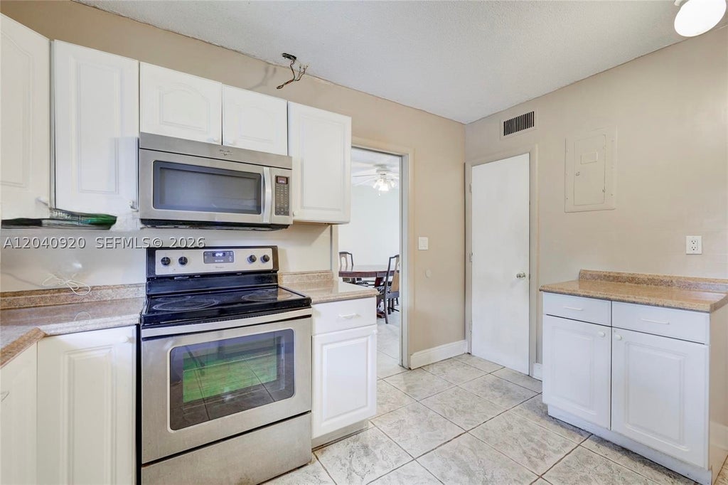 Photo of 350 Sunshine Dr, Coconut Creek, FL 33066 (MLS # A12040920)