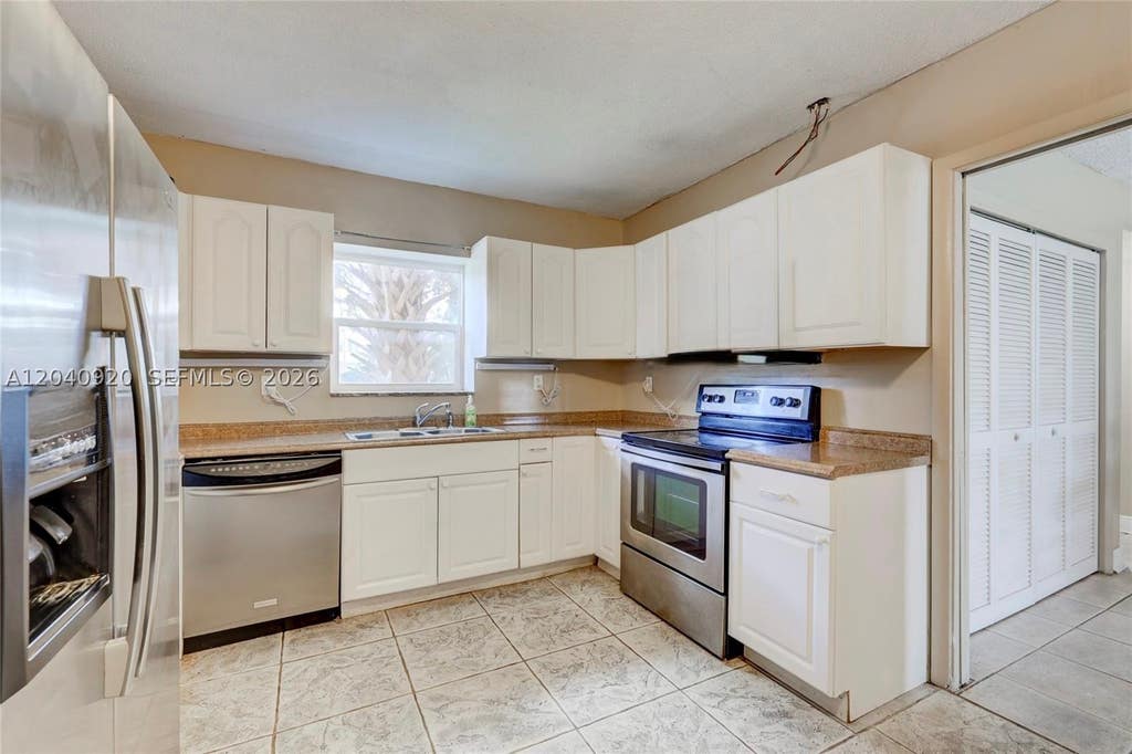 Photo of 350 Sunshine Dr, Coconut Creek, FL 33066 (MLS # A12040920)