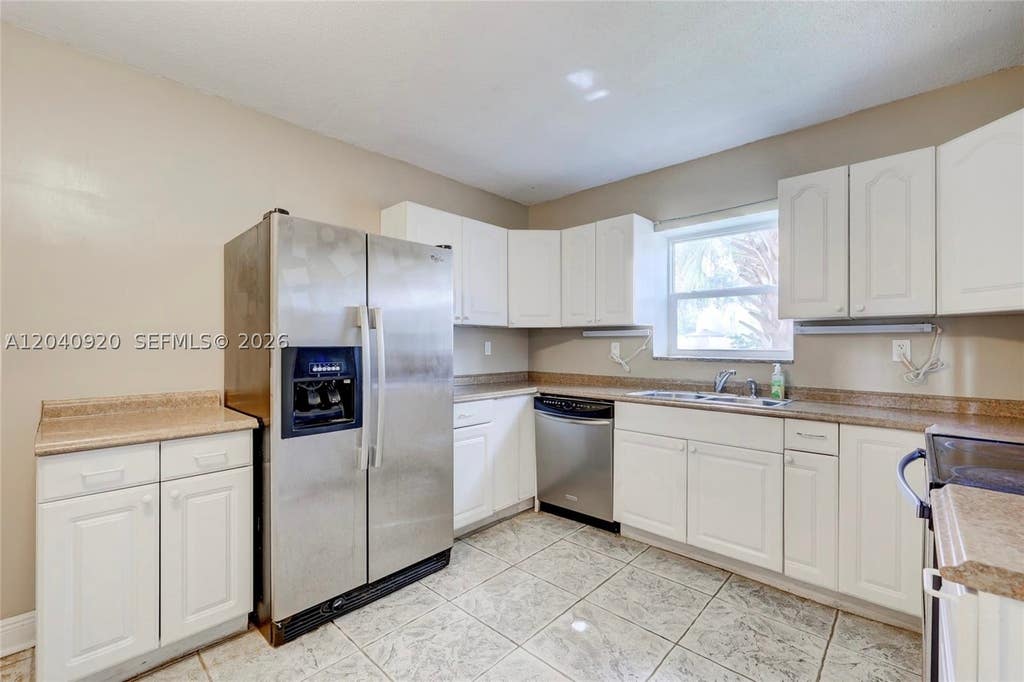 Photo of 350 Sunshine Dr, Coconut Creek, FL 33066 (MLS # A12040920)