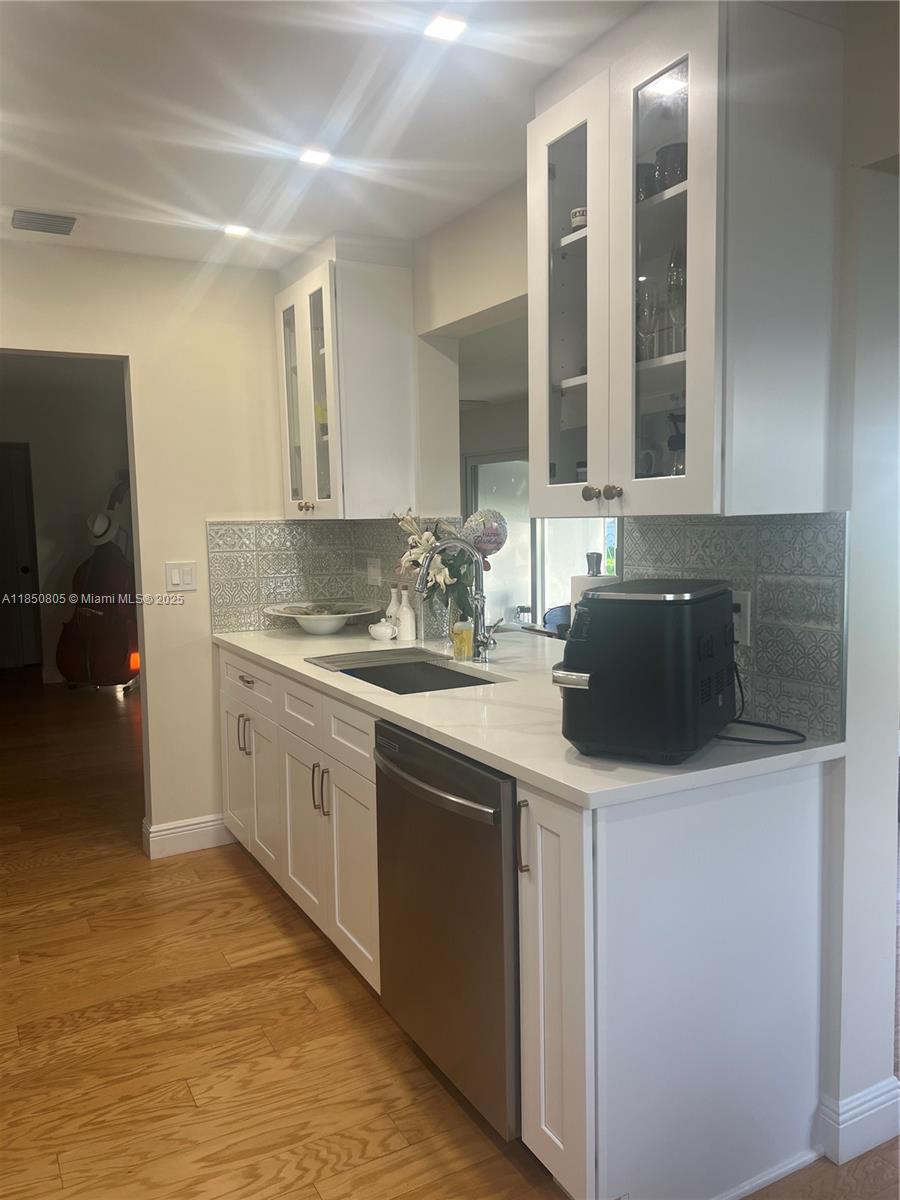 NEW ON THE MARKET ! ENJOY RESORT STYLE LIVING ,COMPLETLY RENOVATED 2/2 +GARAGE SINGLE FAMILY HOME IN LAUDERDALE WEST ,A DESIRABLE ACTIVE 55+COMMUNITY IN PLANTATION .IT FEATURES IMPACT WINDOWS AND DOORS THROUGT OUT ,QUARTZ COUNTER TOPS ,WOOD CABINETS ,STAINLESS STEEL APPLIANCES,WOOD FLOORS TROUGHT OUT AND MARBLE FLOOS IN THE BATHROOMS,WASHER AND DRYER DOUBLE WIDE DRIVEWAY DONE WITH PAVERS .HOA COVERS ROOF REPAIRS/REPLACEMENT ,EXTERIOR PAINT ,LAWN CARE ,CABLE AND INTERNET SERVICE .CLOSE TO MAJOR HIGHWAYS AND THE SAWGRASS MILLS ,SHOPPING AND DINNING AND MORE !!!!!