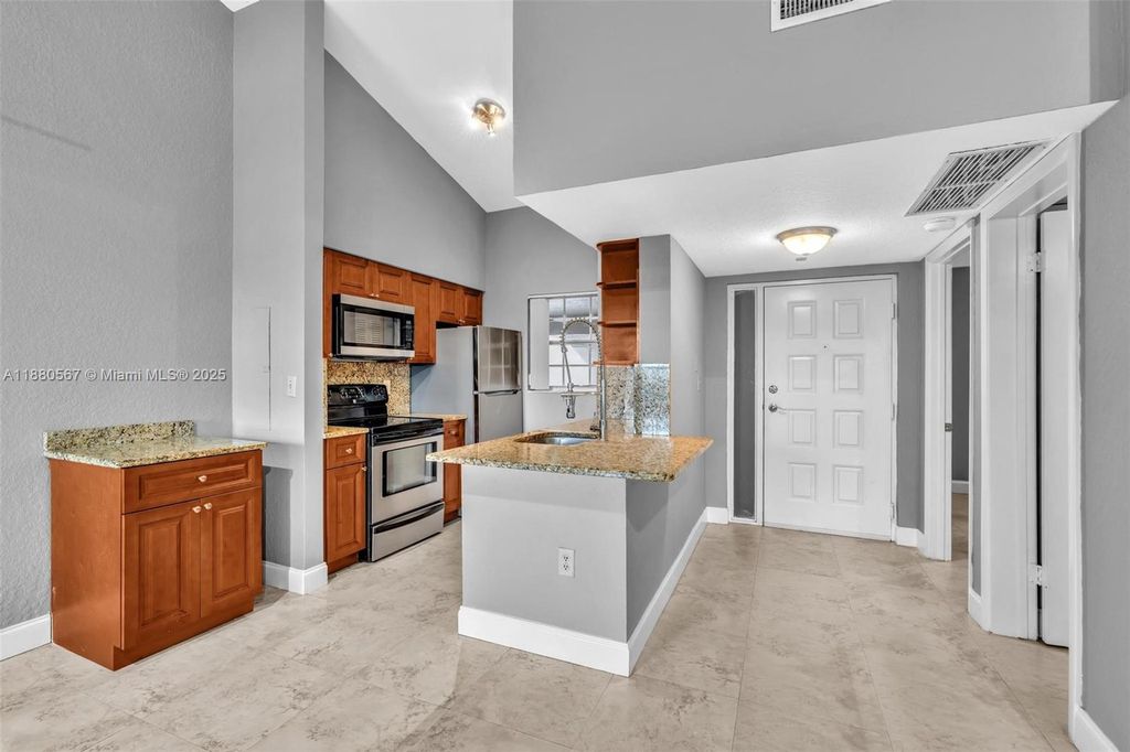 Photo of 2841 N Oakland Forest Dr #304, Oakland Park, FL 33309 (MLS # A11880567)