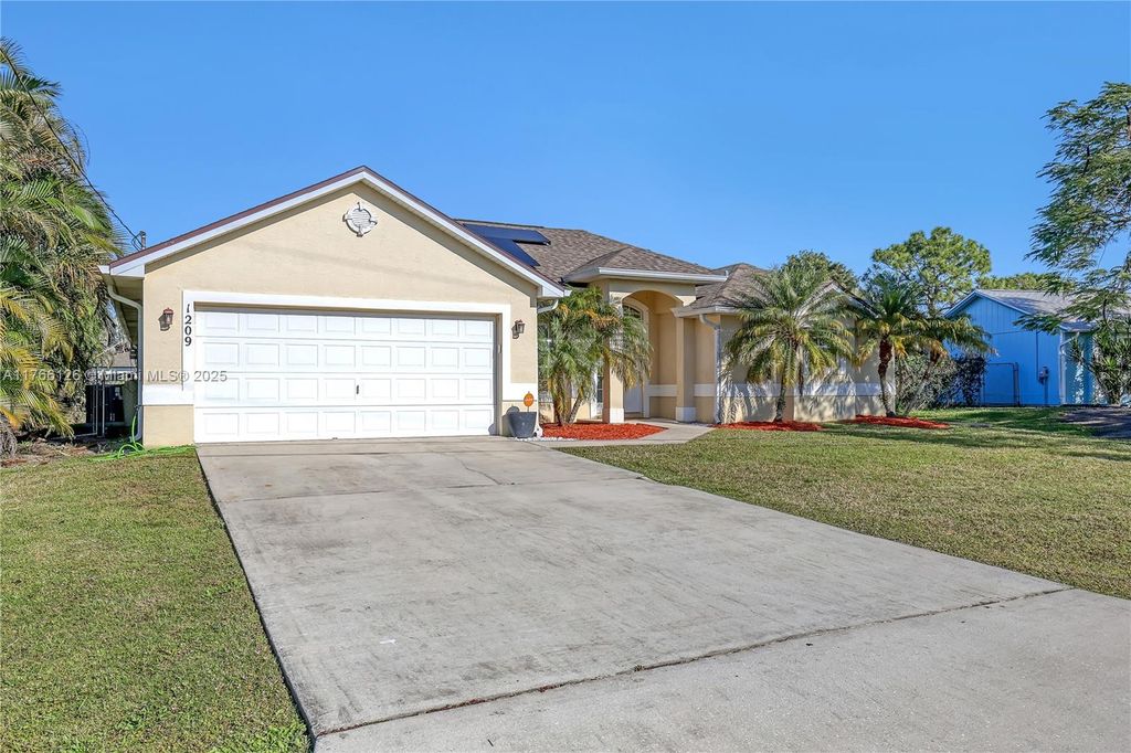 Photo of 1209 SW Glastonberry Ave, Port Saint Lucie, FL 34953 (MLS # A11766126)