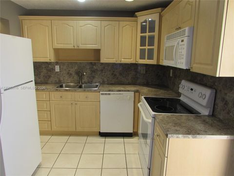 Photo of 5555 Ludlam Rd #23, South Miami, FL 33155 (MLS # A12002616)