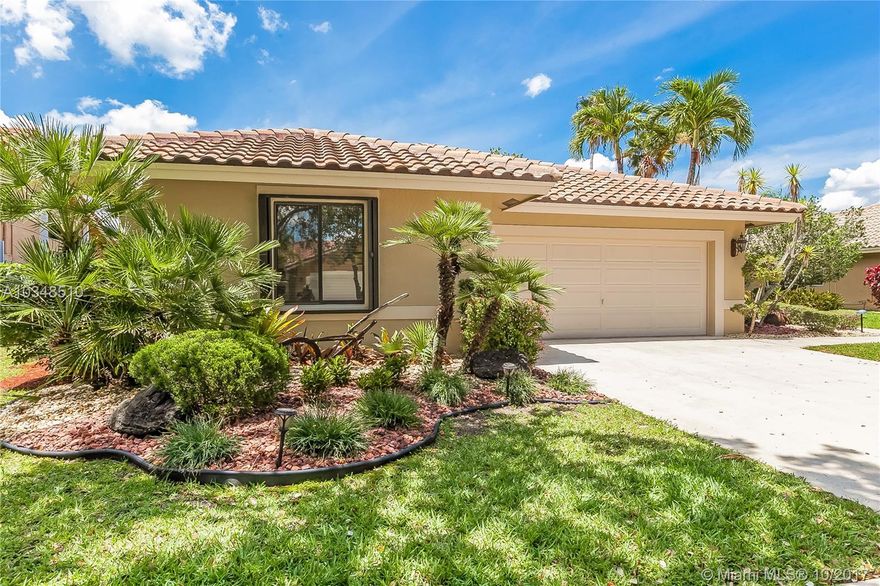 Charming one story home set on private waterfront lot with wide lake views in tree-lined Sunset Springs. Heated and screened geometric pool and spa take advantage of the beautiful vistas. Light and bright interior features skylights and vaulted ceilings. Interior boasts kitchen with wood cabinets, granite counter tops and stainless steel appliances, large neutral tile and updated baths. Recently painted inside and out! Upgraded front yard landscaping. Roof was installed 2014. Full house generator! Community tennis court and play area steps away!