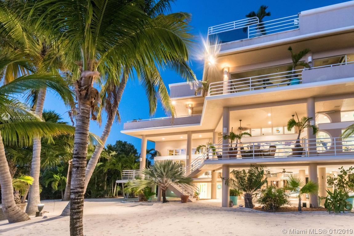Contemporary Luxury in a Florida Keys Atlantic Oceanfront Estate. Each of us has our own idea of Paradise; what is obtainable and what is merely a figment of our imagination. What if we could have all the luxuries we've ever dreamed of in a house combined with breathtaking views, entertainment, special effects and whimsical companions? Allow us to introduce you to ''Modern Elegance''. Ideally located in the fabulous Florida Keys, a chain of tropical islands surrounded by the Atlantic Ocean and the Gulf of Mexico. It's a short drive to Key West's fine dining , galleries and nightlife. You'll notice immediately that this gorgeous home has little in common with typical Keys architecture.