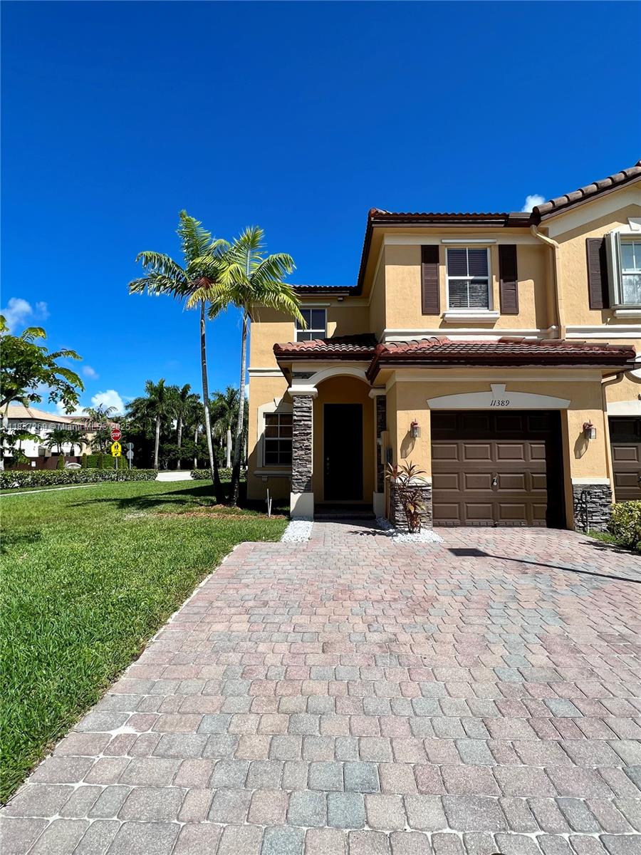 This townhouse is a beautifully furnished 3-bedroom, 2.5-bathroom home in Santorini at Islands at Doral. It boasts a prime location, just a short walk or bike ride to two brand-new public parks and top-rated A+ schools. The home is spacious yet easy to maintain, featuring a well-kept kitchen, formal dining area, and a paved backyard. All bedrooms are generously sized, with the master suite offering an expansive bedroom and bathroom. Additional features include a one-car covered garage plus two outdoor parking spaces. Residents also enjoy access to a stunning clubhouse with a variety of amenities.