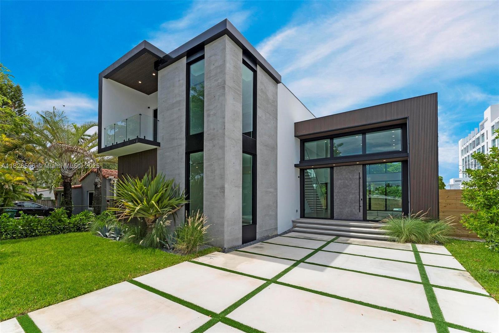 Modern Luxury Living in Shorecrest! Step into contemporary elegance with this brand-new modern masterpiece located just moments from the Intracoastal Waterway. This expansive 6-beds, 5.5-baths home offers an ideal blend of sleek design and luxurious comfort. From soaring ceilings and floor-to-ceiling windows to open-concept living spaces, every detail has been carefully curated for today’s lifestyle. The chef's kitchen features custom cabinetry and a waterfall island perfect for entertaining. A spacious primary suite boasts a spa-like bathroom and private terrace. Enjoy seamless indoor-outdoor living with large sliding doors that open to an oasis with a sparkling pool, integrated spa, and lounge area. Located near top-rated schools, the beach, and the vibrant MiMo District it has it All!