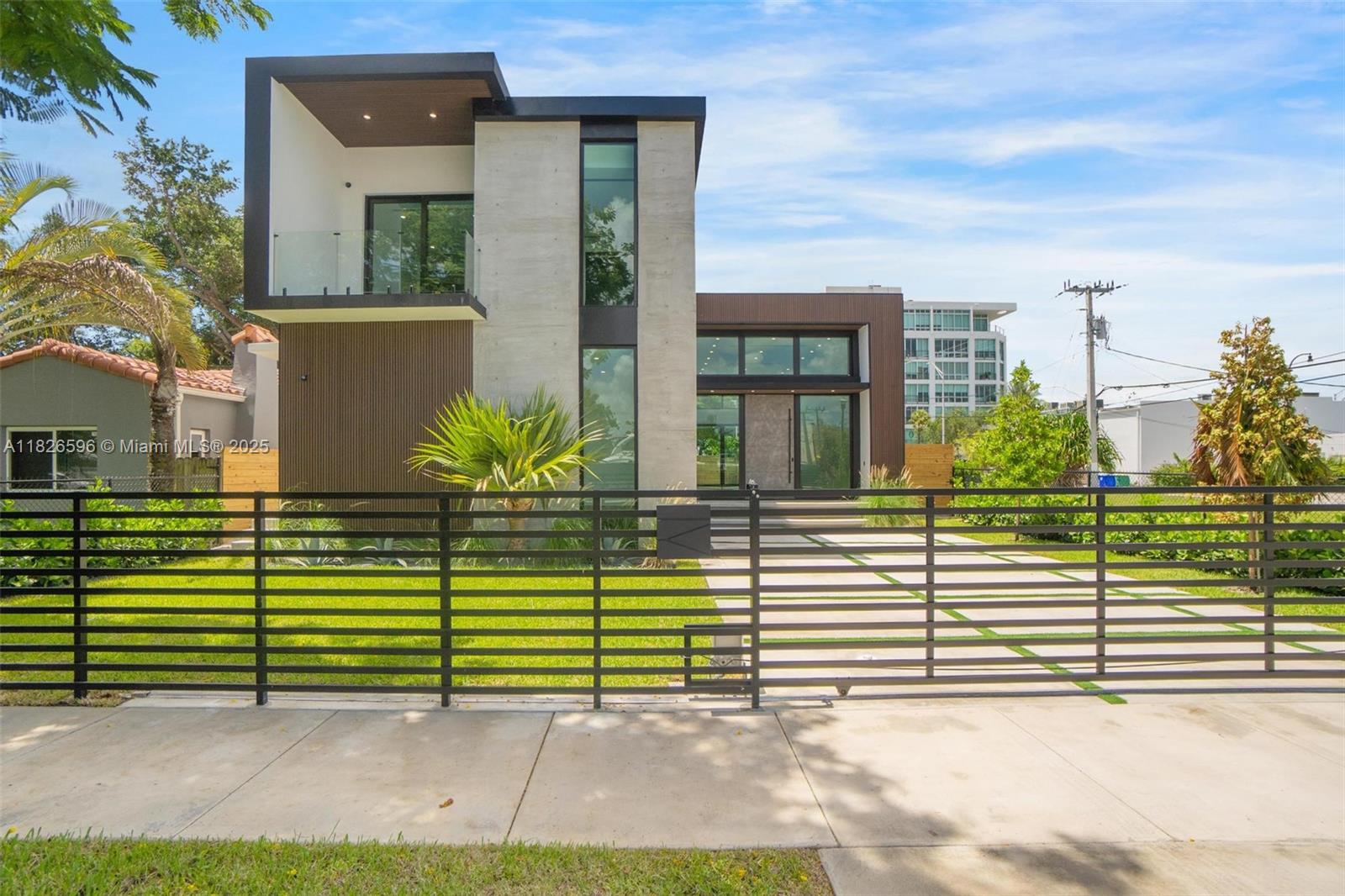 Modern Luxury Living in Shorecrest! Step into contemporary elegance with this brand-new modern masterpiece located just moments from the Intracoastal Waterway. This expansive 6-beds, 5.5-baths home offers an ideal blend of sleek design and luxurious comfort. From soaring ceilings and floor-to-ceiling windows to open-concept living spaces, every detail has been carefully curated for today’s lifestyle. The chef's kitchen features custom cabinetry and a waterfall island perfect for entertaining. A spacious primary suite boasts a spa-like bathroom and private terrace. Enjoy seamless indoor-outdoor living with large sliding doors that open to an oasis with a sparkling pool, integrated spa, and lounge area. Located near top-rated schools, the beach, and the vibrant MiMo District it has it All!