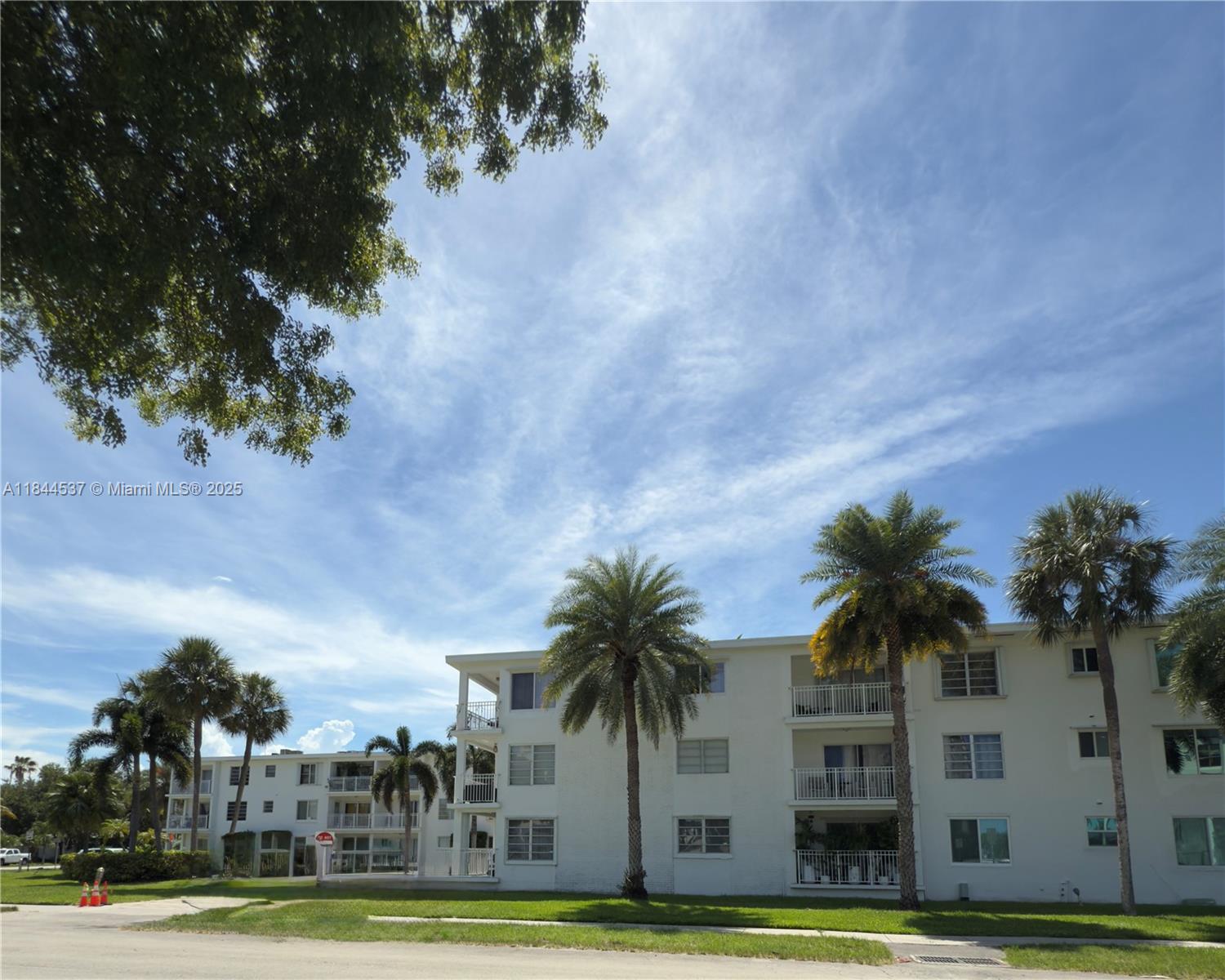Charming 1BD/1BA corner unit with 880 SF in the sought-after Lido Bay Manor, just steps from shops and restaurants. Prime breezeway entrance offers added privacy and fresh air. Enjoy upgraded kitchen with terracotta tile countertops and stainless steel appliances. Tile and laminate floors throughout. Accordion shutters for hurricane protection. Relax on your open balcony or at the community pool. Well-maintained complex with common laundry and assigned parking. Unbeatable location right off US1!
