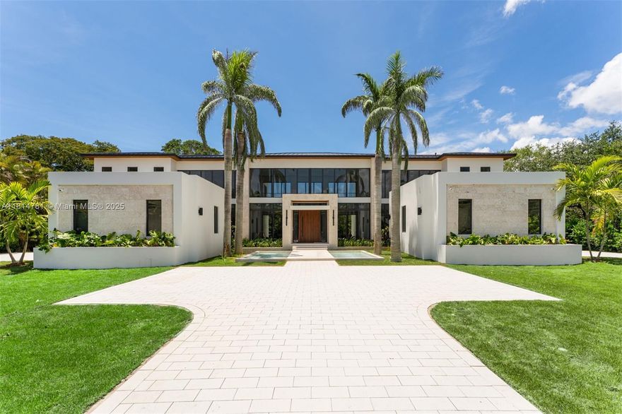 This brand-new transitional masterpiece in the heart of Pinecrest exudes sophistication and elegance. Boasting 8 bedrooms & 9.1 bathrooms across 11,375 SF, it features 2 primary suites, a home theater & a private home office. A separate guest house with a kitchenette adds flexibility for visitors or extended family. The gourmet kitchen is equipped with Subzero refrigeration, Wolf & Al Fresco appliances & custom wood cabinetry. Floor-to-ceiling windows flood the open living spaces with natural light & panoramic views. Enjoy seamless indoor-outdoor living with covered terraces, a heated pool & a summer kitchen. Smart home technology, Control4 automation, full house generator & elevator-ready design & premium finishes complete this rare opportunity to own a truly luxurious Pinecrest estate.