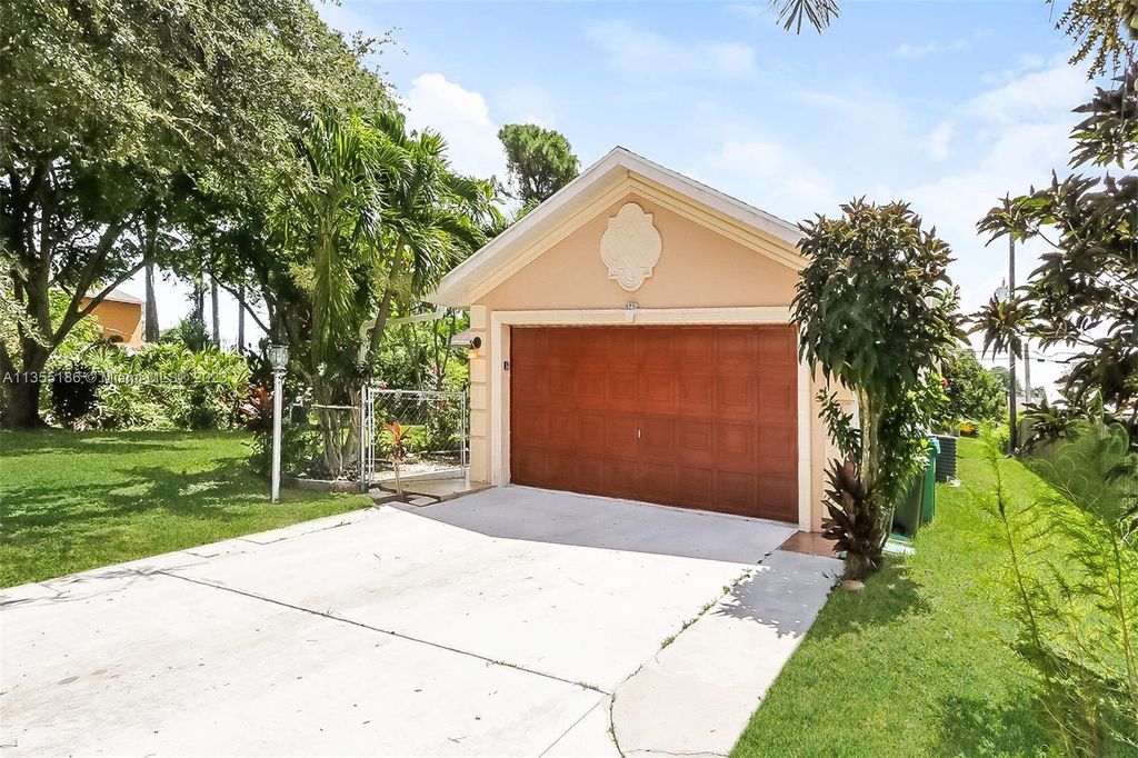 Photo of 1829 SW California Blvd, Port Saint Lucie, FL 34953 (MLS # A11355186)