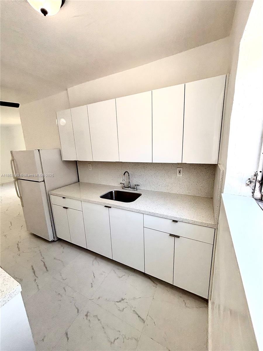 FOR RENT is a tastefully updated apartment in downtown Coral Gables, walking distance to shops and restaurants. Unit offers new tile floors throughout, abundant Kitchen cabinets/pantry, good closet/storage space, updated A/C. Included in rent is water, waste, and 1 assigned parking space. Laundry units onsite and swimming pool access. Please contact listing agent for virtual tour request