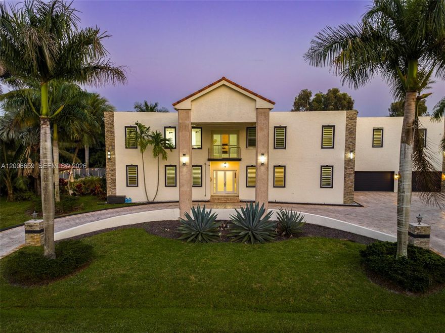 Big homes are common—this one is on another level. Located in the highly sought-after Plantation Acres, this estate delivers true scale, privacy, and presence—something increasingly rare in today’s market.
Spanning over 8,000 sq ft, this 9-bedroom, 6-bath residence is defined by soaring ceilings, massive living spaces, and an incredible sense of openness throughout. Every room feels oversized, from the expansive main living areas to the generously sized bedrooms—ideal for large families, multi-generational living, or hosting on a grand scale.
At the heart of the home is a chef’s kitchen that seamlessly connects to multiple gathering areas, making entertaining effortless. A dedicated home theater and an expansive game room elevate the experience, creating a true in-home entertainment hub.
Set on a huge lot with a massive driveway and oversized garage, the property offers both privacy and functionality—perfect for multiple vehicles, guests, or simply enjoying the wide-open space that Plantation Acres is known for.
The backyard is your private retreat, complete with a pool and endless room to expand, entertain, or design a resort-style outdoor oasis. The scale of the lot provides flexibility that’s rarely available.
Beyond the home, Plantation Acres is one of Broward County’s most desirable communities—known for its quiet, estate-style living, spacious properties, and access to top-rated schools.