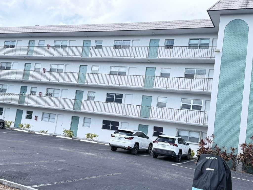 Photo of 4311 Crystal Lake Dr #120, Deerfield Beach, FL 33064 (MLS # A11909512)