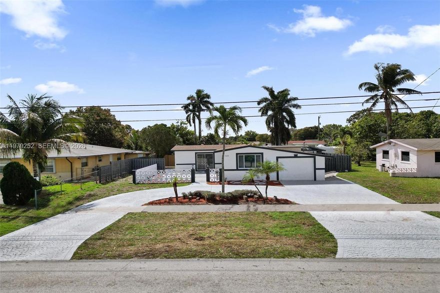 Blow your mind away - Completely renovated 3BD|2 BA waterfront pool home in the heart of Lauderhill! This stunning property features a brand-new kitchen with quartz countertops and sleek black finishes, fully remodeled bathrooms, and new flooring throughout. Entertain in my spacious family room! Roof is 3 years old. Major updates include a new HVAC system, water heater, and driveway, offering peace of mind for years to come. Enjoy relaxing water views and a private pool perfect for entertaining. Conveniently located just minutes from the Florida Turnpike, providing easy access to shopping, dining, and major highways. FHA and VA financing welcome. A true move-in-ready gem!