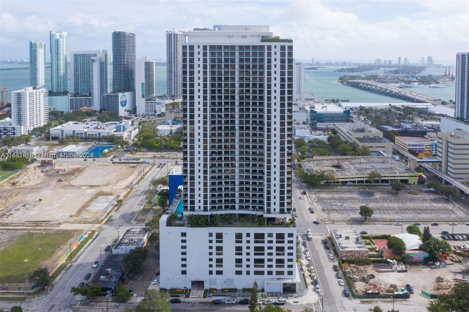 Beautiful High floor Corner unit, 2 bedrooms 2 bathrooms, FULLY FURNISHED. Breathtaking city and water views, very spacious layout, and great location, 15 minutes away from Brickell, Miami Beach, Miami International Airport, and steps away from Wynwood and Midtown. HIGHEST FLOOR CORNER UNIT AVAILABLE IN THE BUILDING. 30,000 sq. ft of amenities including 3 pools, Jacuzzi, 3,000 Sq.Ft. state-of-the-art gym, Sauna & Treatment Room, Yoga Room, Racquetball Court, Theater, Social Room, and Business Center. Basic WIFI/Cable included. UNIT COMES WITH 2 PARKING (ONE GARAGE PARKING AND ONE VALET PARKING )