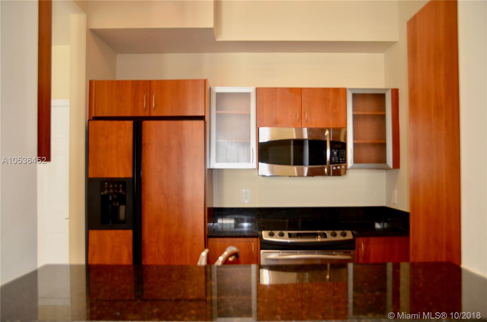 Concierge Chic and Location! Wow, walk to Boca's Best Dining, Music & Dancing! It's all right there for you in this Lower Penthouse home...with the advantage of 10' ceiling height for the VOLUME/OPEN Feel. The Kitchen has Stainless Steel Appliances, Italian Cabinetry with Black Granite counters. there's Upgraded 24" Granite Flooring throughout the Living room and Master bedroom. Washer/Dryer in the unit. and the patio overlooks the resort style pool. 1 garage parking spot. Clubhouse, Business Center, state of the art Fitness Center, On-Site management, Party Room and Concierge Service. Pool with Spa/Hot Tub. 24hr Valet. Library.