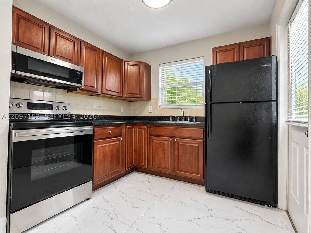 Photo of 616 SW 14th Ave #102, Fort Lauderdale, FL 33312 (MLS # A12097152)