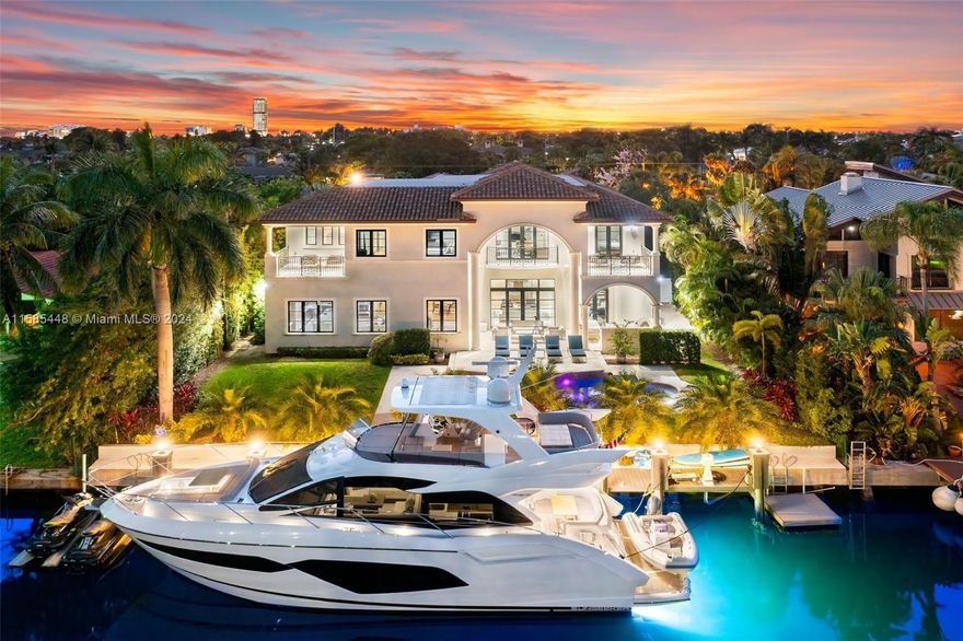 Nestled in the exclusive gated community of Golden Isles, this meticulously crafted waterfront masterpiece boasts 6 bedrooms and 7.5 lavishly appointed bathrooms. Revel in the luxury of a state-of-the-art gourmet kitchen. Adorned with marble and wood floors, the grandeur of this residence begins upon your first step inside the foyer entrance that extends to the spacious living room, formal dining room, family room, and inviting bar and breakfast area. Ascend the heights of luxury with the convenience of an elevator, a 3-car garage, and three magnificent terraces. Enveloped in exclusivity, a private dock awaits with 85 feet of water frontage, ready to accommodate a large yacht, ensuring a lifestyle of unparalleled refinement and sophistication.