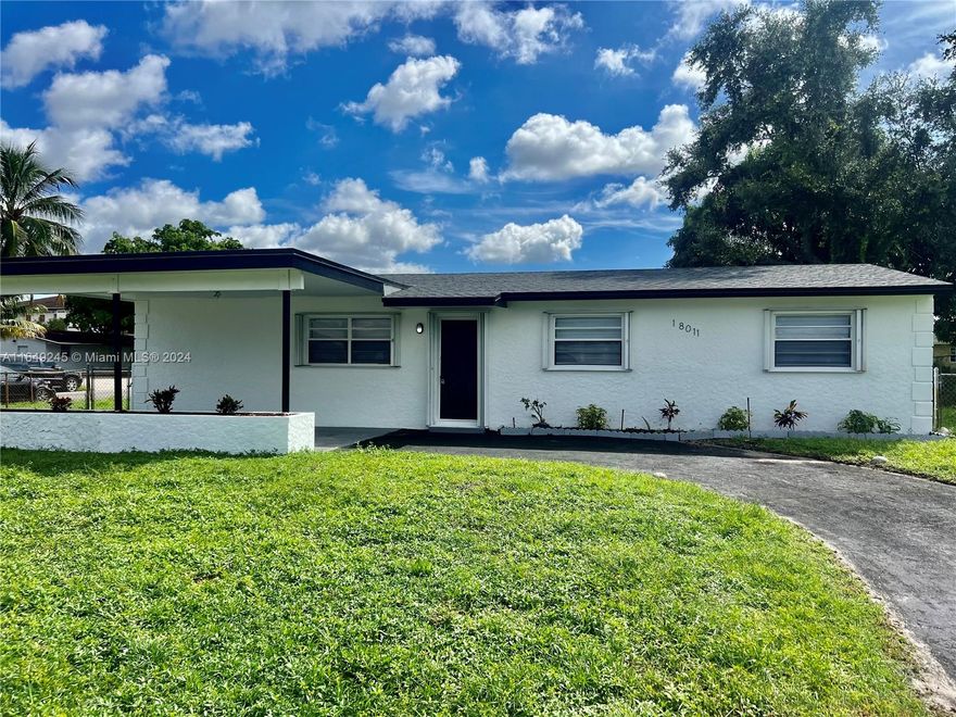NEW PRICE: Prime Miami Gardens Location with Brand New Roof! This single-family home features a designer kitchen and bathrooms, offering 3 bedrooms and 2 bathrooms with generous living area on a 7,875 square foot lot. The home includes tile and laminate flooring throughout, spacious rooms, walk-in closets, a large family room, and a carport. The interior has been freshly painted. The property also comes with complete accordion shutters for added security and storm protection. A generous laundry room and a fenced yard add to its appeal. Move-in ready!