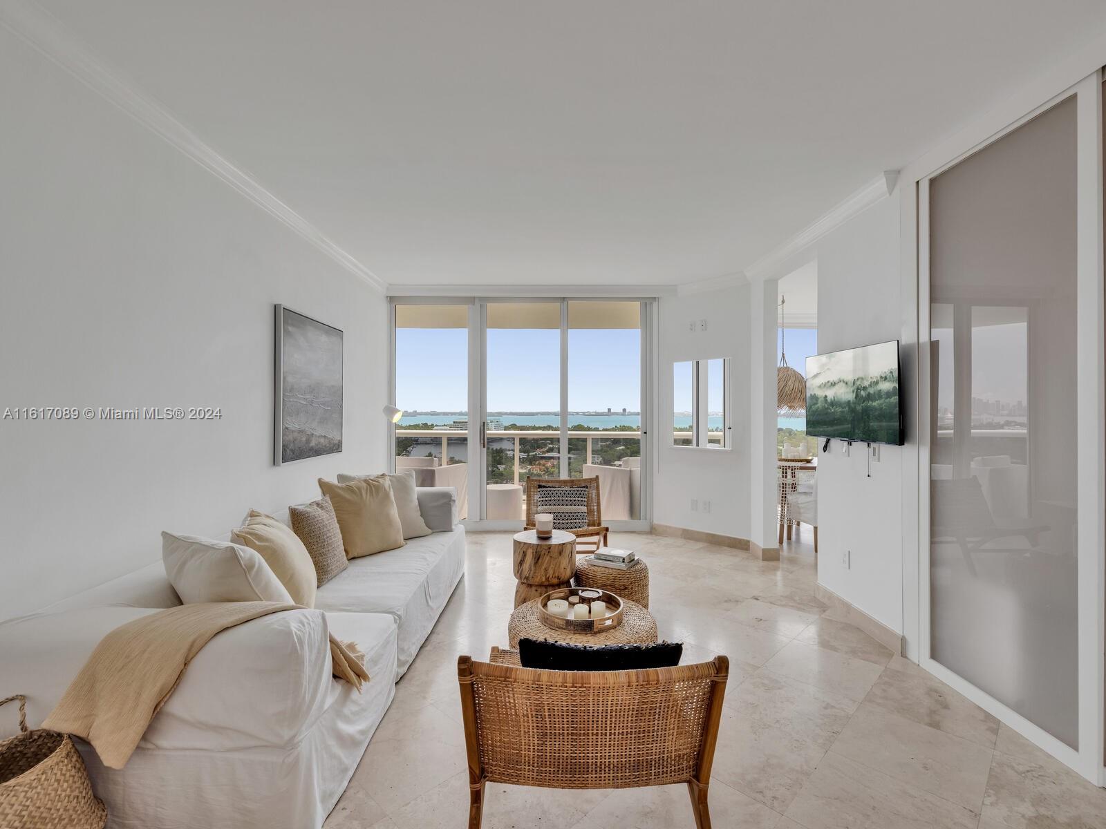 This furnished one-bedroom plus den has been converted into a second bedroom and features two full baths with marble flooring throughout. Enjoy unobstructed views of the city and the bay from the large balcony. The main bedroom boasts a spacious walk-in closet and an en-suite bathroom with a separate Jacuzzi and shower. Floor-to-ceiling windows provide plenty of natural light. The building offers incredible amenities and is strategically located in mid-Miami Beach, making it an ideal choice for luxury living. Available for six months or a year.
