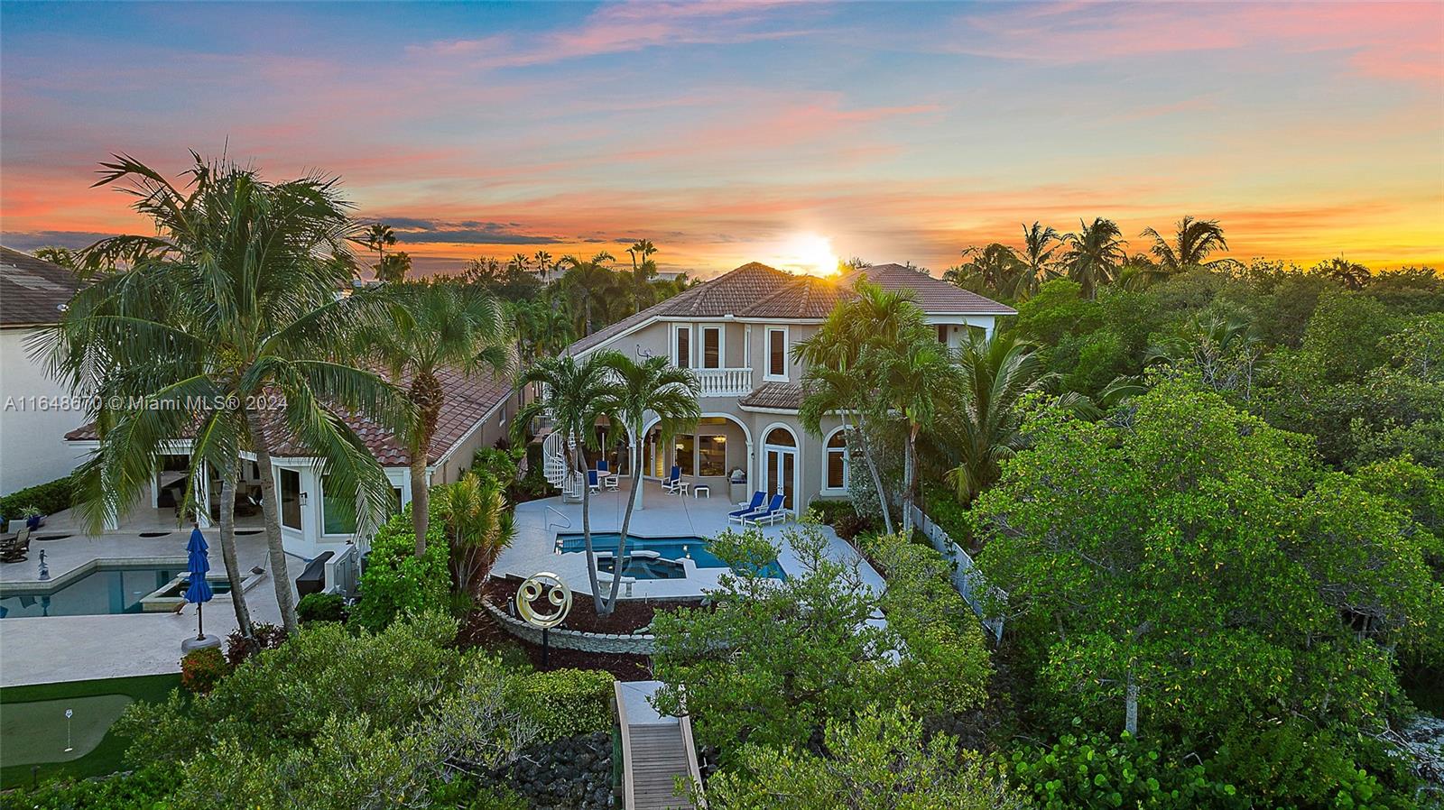 BOATERS DELIGHT Nestled on the pristine Intracoastal Waterway with direct, no-fixed-bridge access to the ocean this exquisite 4-bedroom home offers the perfect blend of luxury and convenience. Ideally located just minutes from shops, restaurants, and beautiful beaches, this residence features an open floor plan that flows seamlessly from room to room. The spacious master bedroom is conveniently situated on the first floor, offering privacy and easy access. Enjoy Florida living at its finest with a large patio and pool, surrounded by lush tropical landscaping. The home also boasts a custom wood office, perfect for those who work from home or seek a quiet retreat. This is waterfront living at its best.