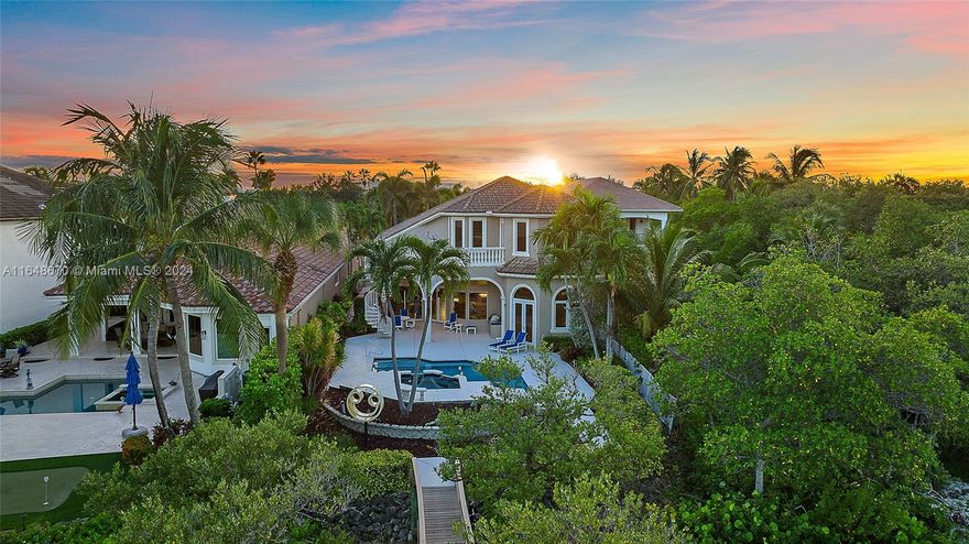 BOATERS DELIGHT Nestled on the pristine Intracoastal Waterway with direct, no-fixed-bridge access to the ocean this exquisite 4-bedroom home offers the perfect blend of luxury and convenience. Ideally located just minutes from shops, restaurants, and beautiful beaches, this residence features an open floor plan that flows seamlessly from room to room. The spacious master bedroom is conveniently situated on the first floor, offering privacy and easy access. Enjoy Florida living at its finest with a large patio and pool, surrounded by lush tropical landscaping. The home also boasts a custom wood office, perfect for those who work from home or seek a quiet retreat. This is waterfront living at its best.