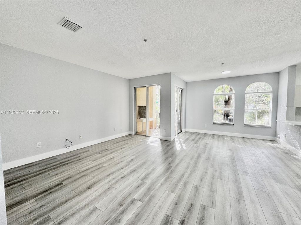 Photo of 120 Jacaranda Country Club Dr #101, Plantation, FL 33324 (MLS # A11923432)