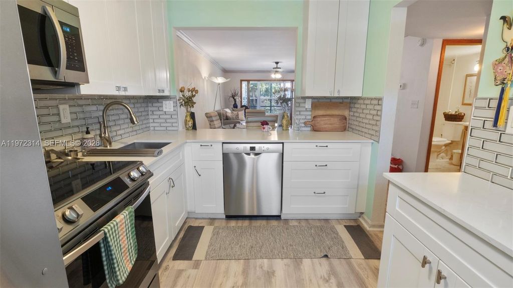 Photo of 8605 W Sample Rd #202, Coral Springs, FL 33065 (MLS # A11972314)