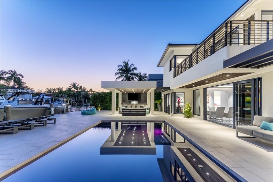 Modern luxury living in security gated Keystone Point with partial open bay views. Built in 2018 this 6 bed, 6.5 bath home has open plan indoor and outdoor living, and living areas bathed in natural light through floor-to-ceiling windows. European kitchen equipped with top-of-the-line Sub-Zero & Wolf appliances, and sliding doors to close off when entertaining. Entertain effortlessly with fully stocked bar area, temperature-controlled wine storage, and telescopic doors that open living areas to the outdoor pool area. Primary suite features a custom walk-in closet and breathtaking sunset bay views. Crestron smart home. 75 feet of water frontage with easy access to the open ocean. Minutes away from Whole Foods, nearby world-class shopping and fine dining in Bal Harbor Mall.