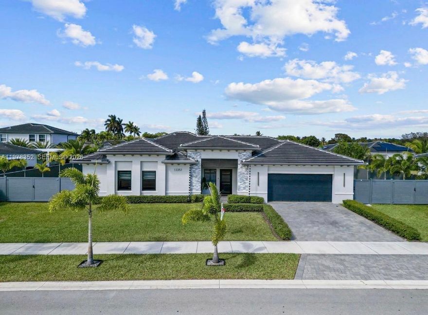 EXPERIENCE REFINED LUXURY IN THIS ELEGANTLY UPGRADED LENNAR EXECUTIVE HOME RESIDENCE, IDEALLY SITUATED ON AN EXPANSIVE 13,109 SQ. FT. LOT BUILT IN 2022. THIS STUNNING ONE-STORY 3-BEDROOM, 2.5 BATH POOL HOME WITH A TWO-CAR GARAGE SHOWCASES SOPHISTICATED, RESORT-STYLE LIVING WITH OVER $400K IN PREMIUM UPGRADES.
HIGHLIGHTS INCLUDE A WHOLE-HOME WATER PURIFICATION SYSTEM, FULL ALUMINUM FENCING WITH DESIGNER GATES, FULLY AUTOMATED ELECTRICAL SYSTEM, LANDSCAPE LIGHTING, RING SECURITY CAMERAS WITH FLOOD LIGHTS, AND IMPACT WINDOWS AND DOORS WITH ENHANCED THICKNESS THROUGHOUT. INTERIOR FEATURES INCLUDE NEW PORCELAIN FLOORING, WOOD LAMINATE IN BEDROOMS, QUARTZ WATERFALL COUNTERTOPS, CUSTOM BUILT IN WALKING CLOSET AND DESIGNER LIGHTING.
THE OUTDOOR SPACE IS DESIGNED FOR ENTERTAINMENT AND FAMILY ENJOYMENT, FEATURING A CUSTOM SALTWATER POOL WITH BEACH ENTRY, EXPANSIVE POOL DECK, AND A COVERED PERGOLA WITH SUMMER KITCHEN AND HIGHEND OUTDOOR APPLIANCES. ADDITIONAL UPGRADES INCLUDE AN IRRIGATION SYSTEM WITH PRIVATE WELL, EPOXY GARAGE FLOORS, AND A SEPARATE A/C UNIT ASSIGNED FOR THE GARAGE WITH CUSTOM BUILT IN CABINETRY.
THIS ONE-OF-A-KIND, RARELY AVAILABLE TURNKEY PROPERTY DELIVERS THE PERFECT BLEND OF ELEGANCE, CONFORT, AND  MODERN CONVENIENCE.