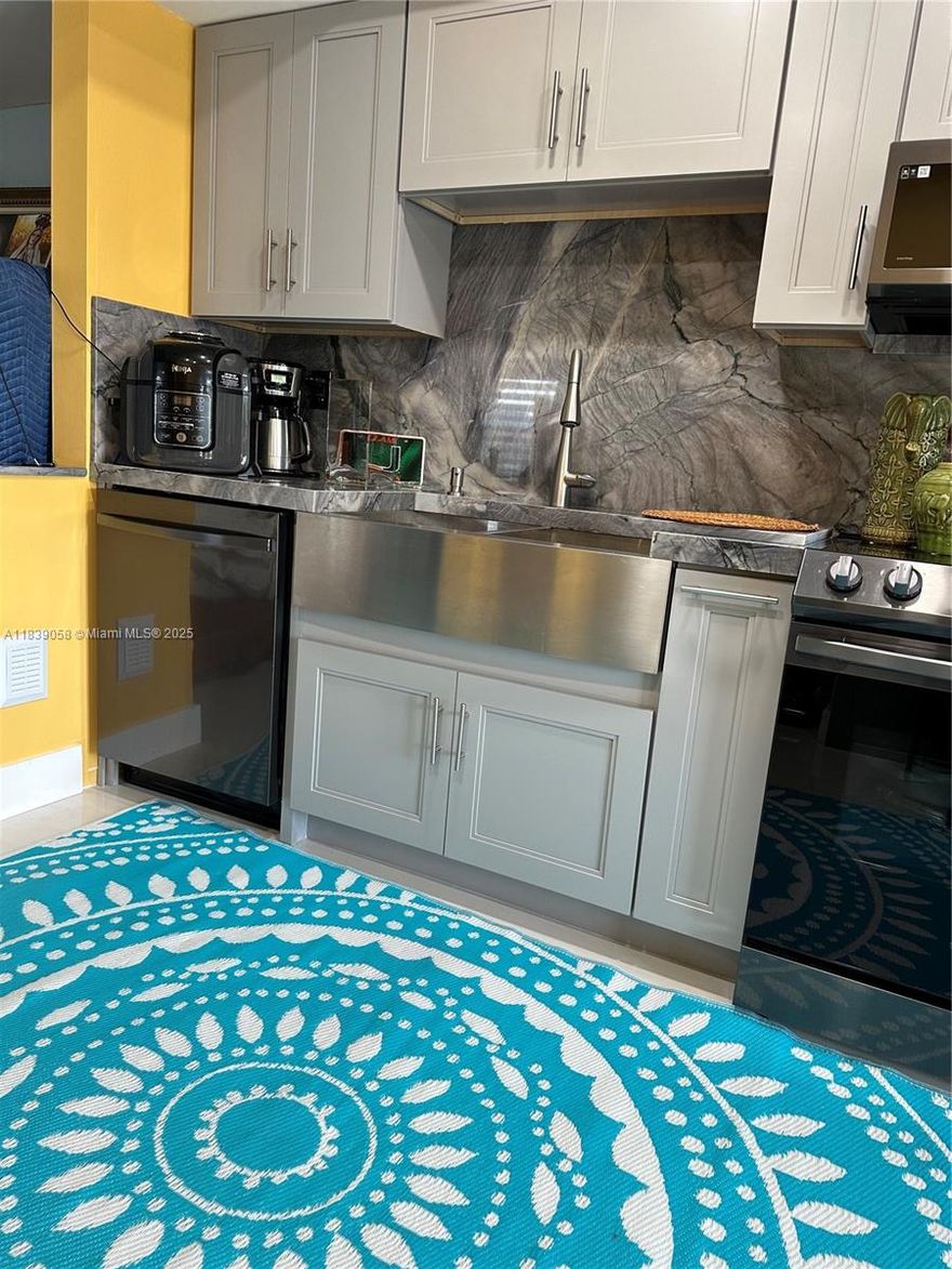 Welcome to this fabulous enclave in Kendall! This beautifully updated townhouse features a charming fenced front yard, perfect for welcoming family and friends. Step inside to a newly renovated kitchen with elegant quartz countertops and top-of-the-line appliances, complemented by hurricane impact doors and windows installed in 2024 and a brand-new roof in 2024 for added style and peace of mind. The spacious layout offers 4 bedrooms, 2.5 bathrooms, and a versatile den—ideal for a home office or playroom. Enjoy a generous master suite, a formal living room, and inviting family and dining areas, perfect for both relaxation and entertaining.