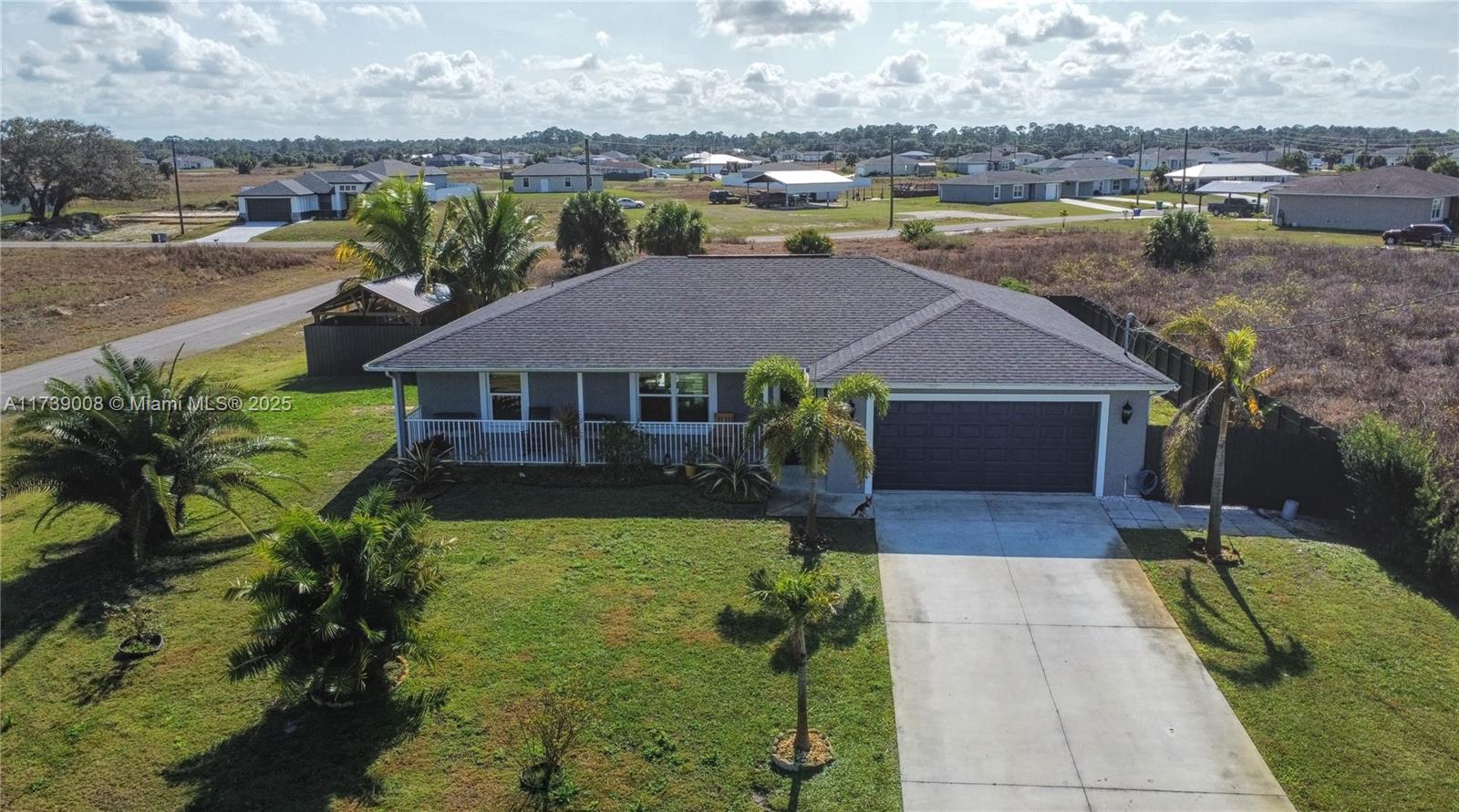 Charming Move-In Ready Home in Port LaBelle, FL - A Perfect Blend of Comfort and Style. Coming in at more than 1,500 square feet with a front porch designed for relaxed country living, this house delivers an open floor plan, dual walk-in closets in the master, 3-bed, 2-bath features tiles floors, soft close cabinetry, granite countertops throughout, his and hers sinks and closets, vaulted ceilings, and a beautiful backyard. and enough amenities to ensure you enjoy your time spent inside and out! Don't miss this remarkable property! Schedule a showing today.