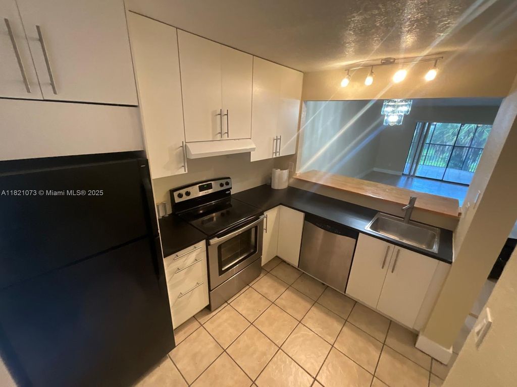 Photo of 3470 Foxcroft Rd #211, Miramar, FL 33025 (MLS # A11821073)