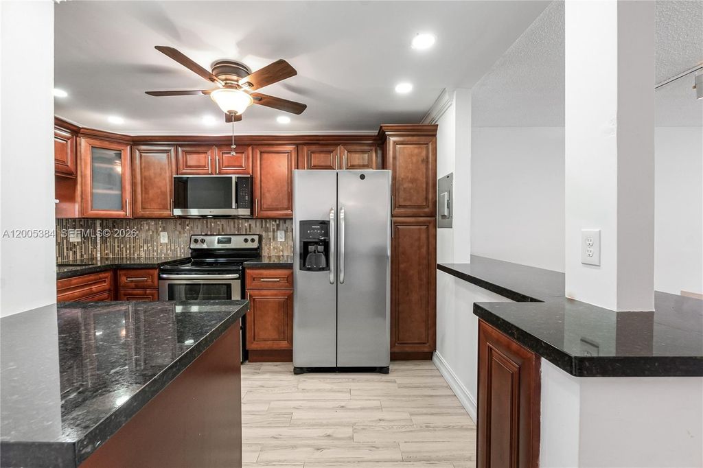 Photo of 711 S Hollybrook Dr #209, Pembroke Pines, FL 33025 (MLS # A12005384)