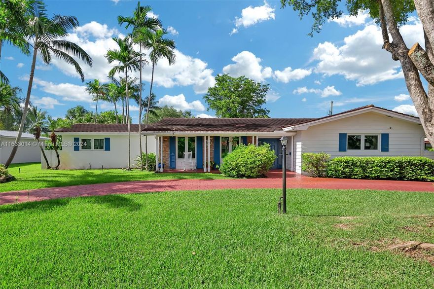 Enchanting 4 bdrm, 2 bath home in the fantastic community of Mangowood in Palmetto Bay. Adorable curb appeal w/ brick detail, charming blue shutters & cozy front porch perfect for relaxing in a rocking chair! Fabulous open concept formal living, dining rm opens to remodeled kitchen w/ eat in/snack bar, center island, walk in pantry. Large family rm overlooks the sparkling pool. Spacious indoor laundry rm w/ sink.  Great, fenced backyard perfect for entertaining w/ screened pool, deep covered patio, built-in BBQ & shed. Impact windows/doors, newer vinyl flooring. Split bdrm plan. Primary suite has en-suite bath, dual sinks, combo shower/tub plus double closets. Nicely sized guest bdrms. Circular driveway, 2 car side entry garage. Close proximity to A+ schools and Coral Reef Park.