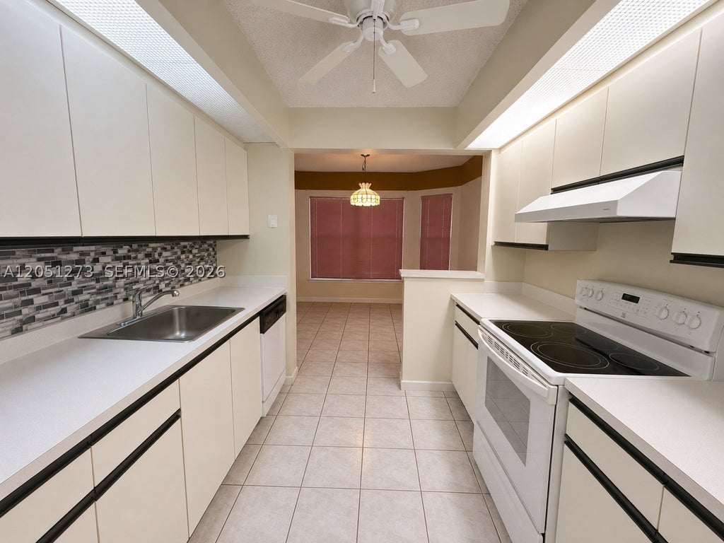 Photo of 12950 SW 4th Ct #209H, Pembroke Pines, FL 33027 (MLS # A12051273)