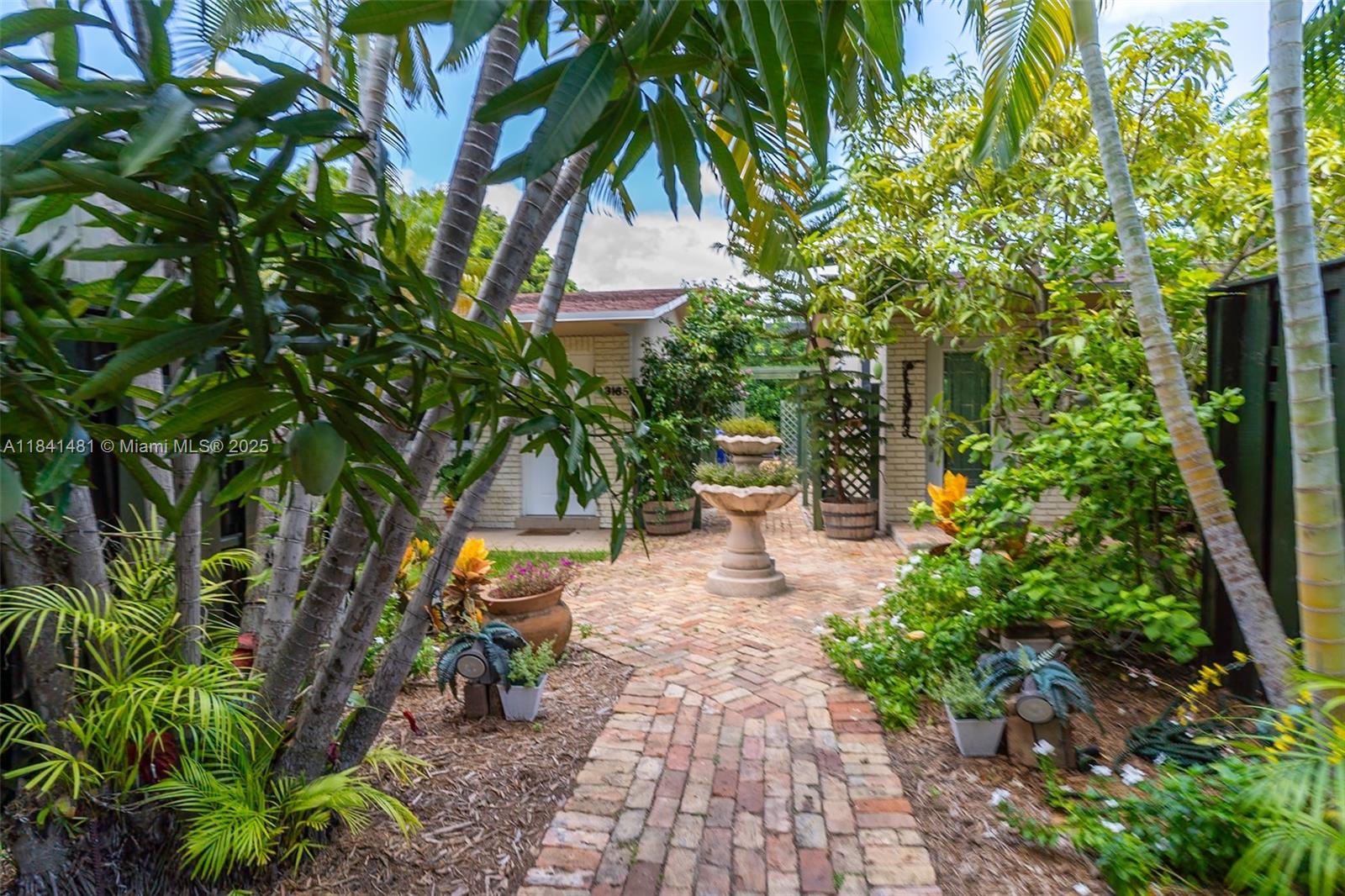 In the heart of coveted Coconut Grove’s Center Grove neighborhood, this charming updated single-story townhouse features 3 beds and 2 baths, with a modern open kitchen and bright, inviting spaces. Enjoy seamless indoor-outdoor living on the expansive +/- 400ft patio, surrounded by a lush garden featuring avocado, mango, and lychee trees, as well as a serene pool and classic Boston brick walkways. Benefit from a low monthly maintenance, new A/C, and walkability to CocoWalk, parks, marinas, and top schools. Nestled on a quiet, tree-lined street—this is South Florida charm at its finest. Schedule your private tour today and experience Coconut Grove townhouse living at its best!